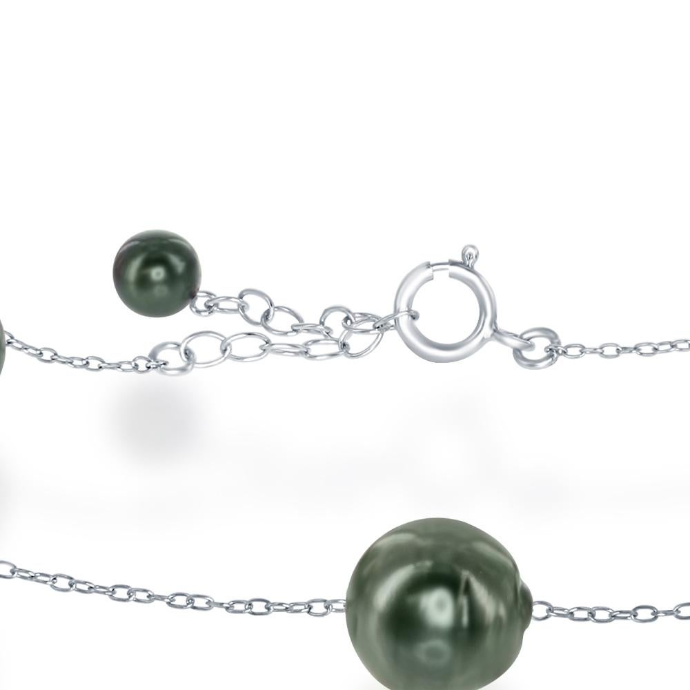 This tin-cup style sterling silver bracelet features cultured South Sea Tahitian baroque 9-10mm pearls. The bracelet has an adjustable length of either 7 or 8 inches. 
