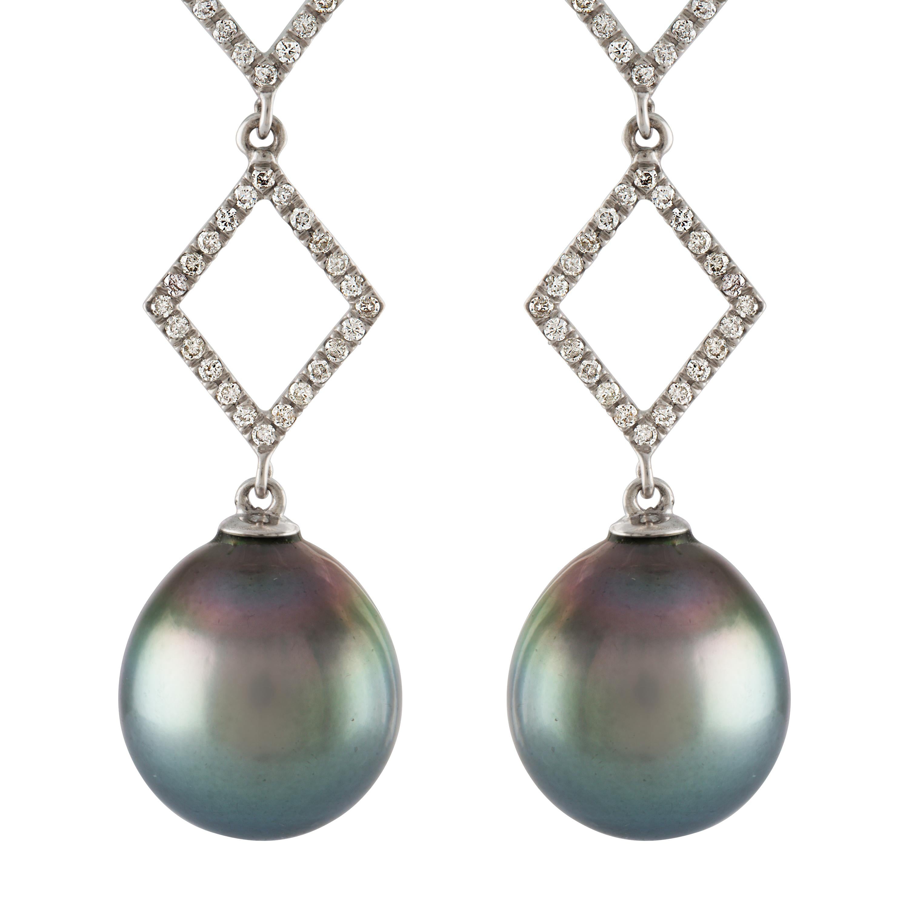 These earrings feature South Sea Tahitian cultured drop pearls measuring 14.3x16mm.
 The pearls are dangling from 14 karat white gold and diamond geometric graduating consisting of 0.78 carats of diamonds. 
The pearls have high luster with strong