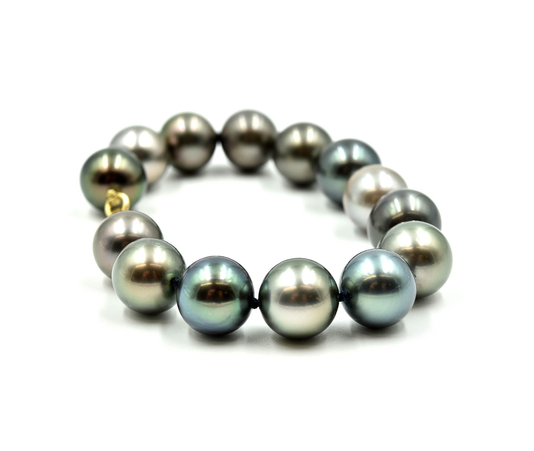 Designer: custom design
Material: 14k yellow gold
Pearls: south sea Tahitian pearls measuring 11.5mm – 11mm in diameter
Dimensions: bracelet is 7 inches long
Weight: 29.23 grams
