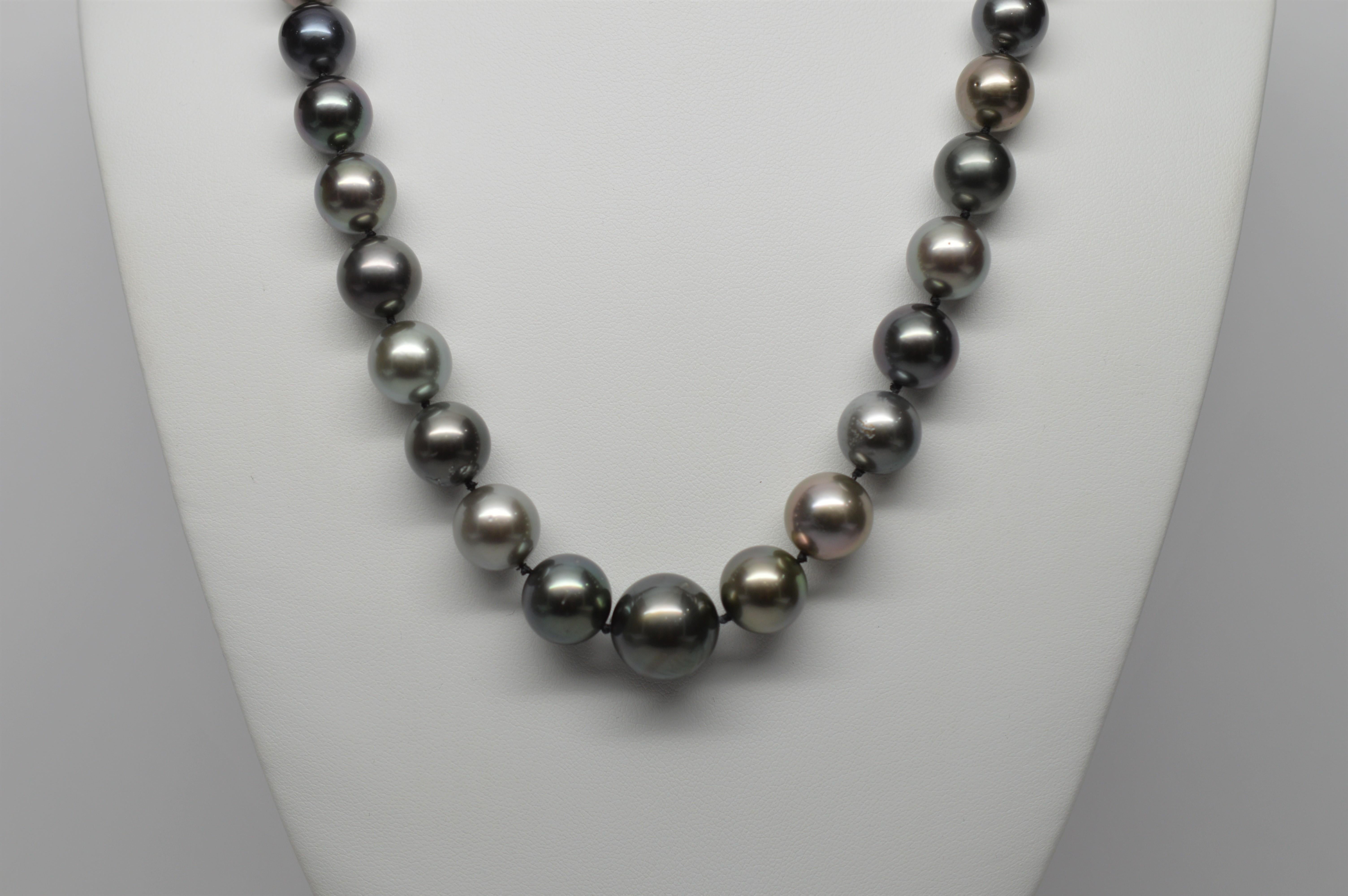 Fabulous fine South Sea Tahitian Pearl Necklace consisting of forty-one genuine graduated lustrous rich Tahitian Pearls ranging from 10.5mm to 15.25mm. The strand measures 20 inches and is finished with a 14K White Gold decorative clasp with Diamond