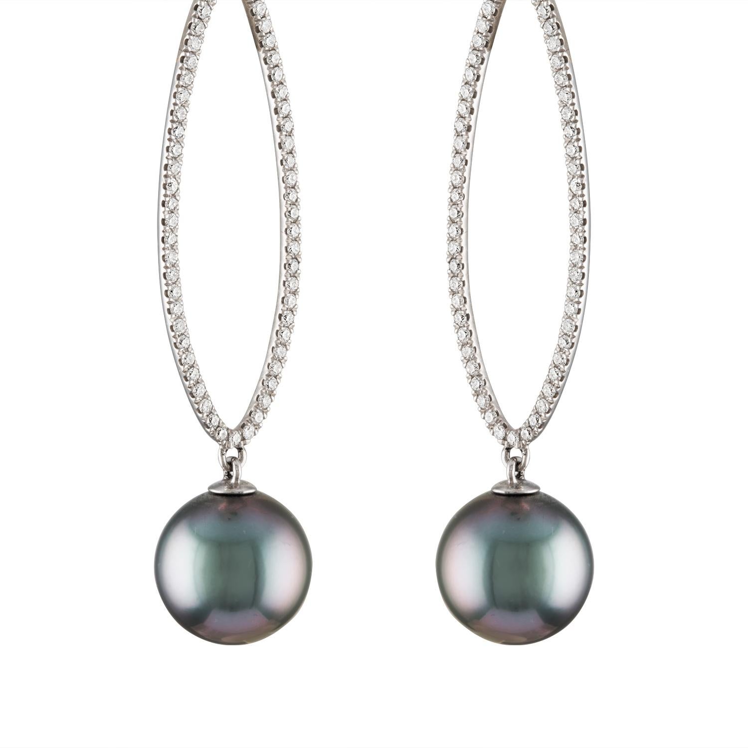 These South Sea Tahitian cultured pearl and diamond dangle earrings are set in 14K white gold with perfectly round, spotless 12.5mm pearls and .87 total carats of diamonds.
These pearls feature peacock overtones, high luster and very clean
