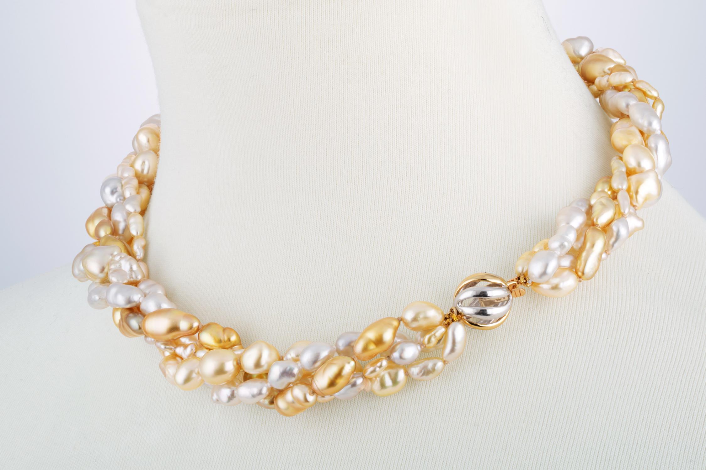 This multi strand South Sea white and South Sea golden Keshi cultured pearl necklace features multiple strands of pearls that range in size from 4 to 10mm. There are four strands of pearls strung in a twisted design with a clasp that features 14