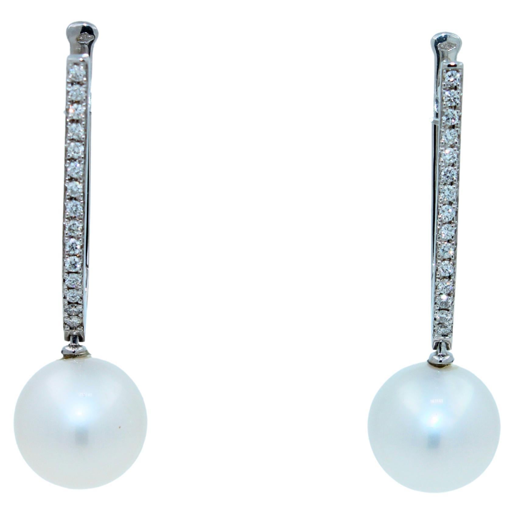 White AAA Quality South Sea Pearls
Size 14MM Diameter
Striking Silvery Hue with Light Blue Iridescent  Tones
Very Reflective Surface - Almost Mirror-Like 
1.50 cts Diamonds VVS Quality
14.35 Grams Total Weight
5 cm length of full earrings
18K White