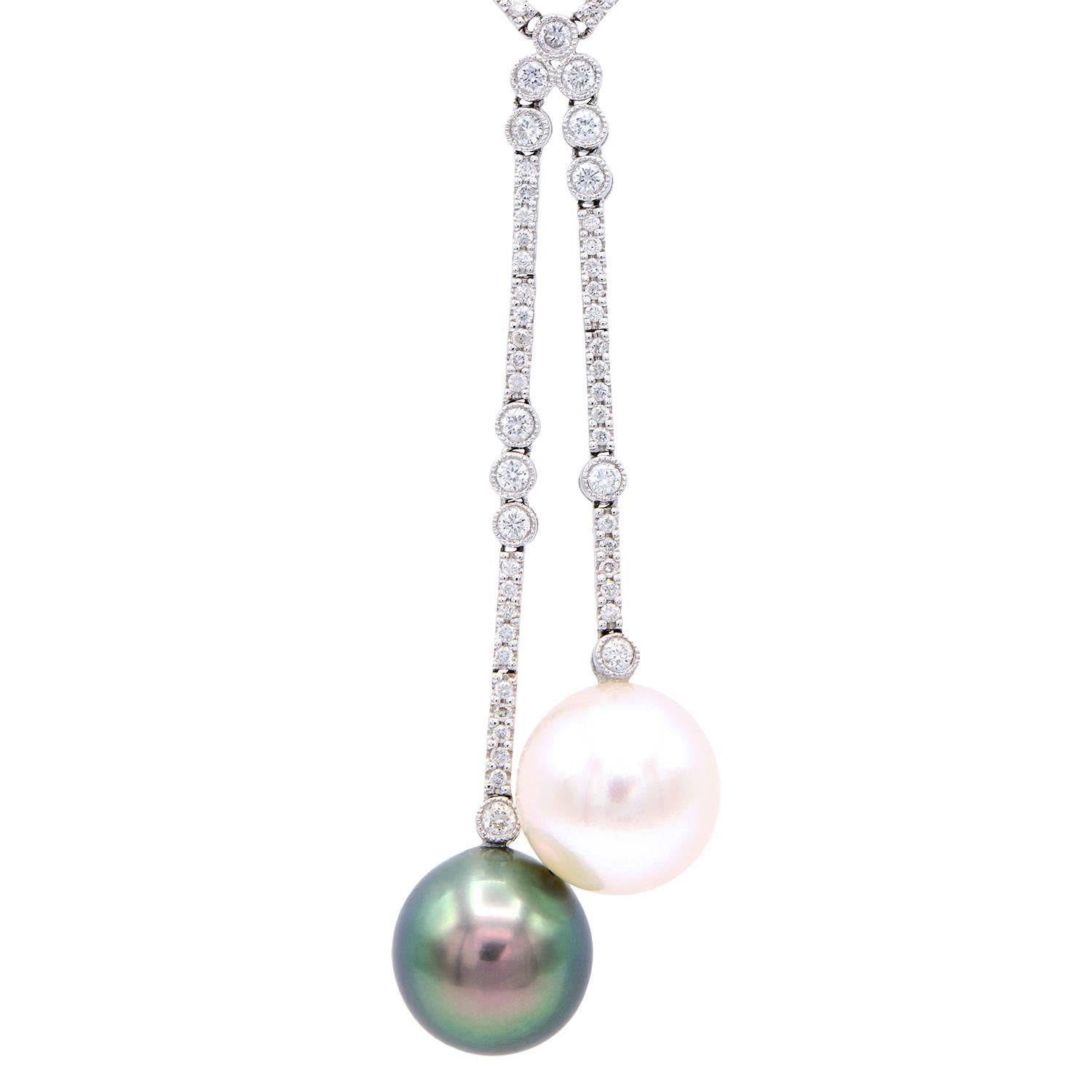 This gorgeous diamond necklace contains 115 SI1/2 H/I color diamonds totaling 0.98 carats which are mounted in 7.5 grams of 18 karat white gold. The finishing touches to this beautiful necklace are the two 11-12 mm south sea and Tahitian pearls