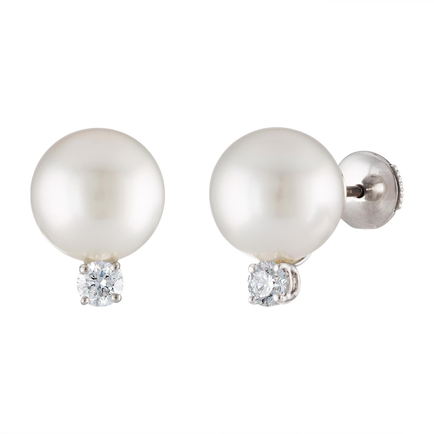 These elegant South Sea cultured pearl and diamond stud earrings consist of 11.7mm pearls set on 18 karat white gold accented by 0.49 carats total of sparkling diamonds.
These versatile earrings can be worn dressy or casual. They are a staple for