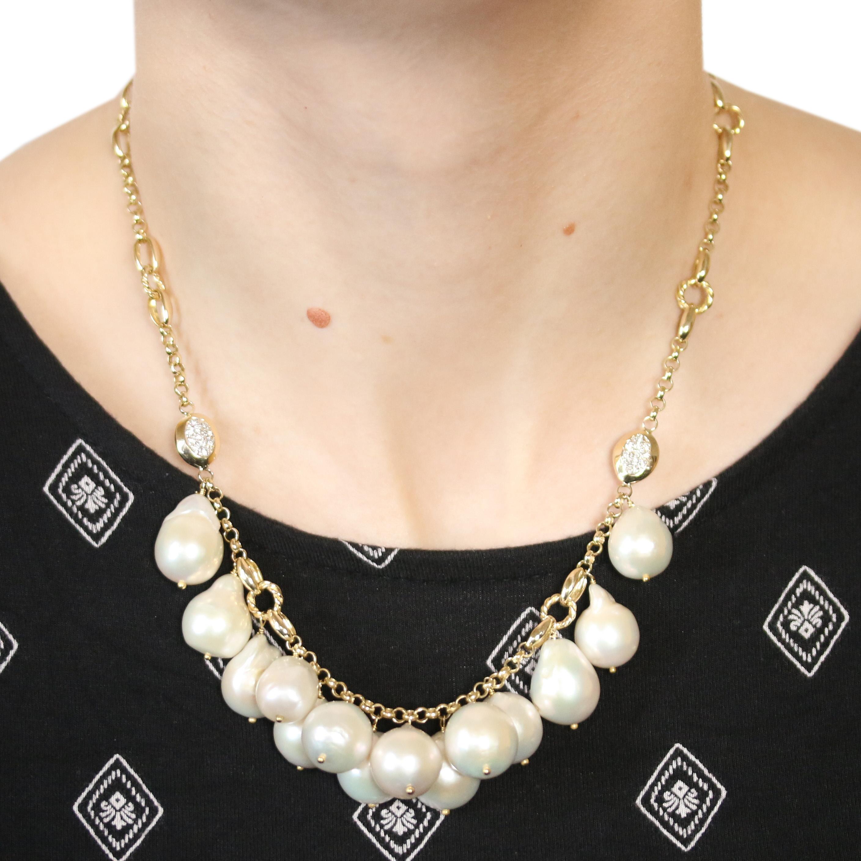 Define your style with this fabulous signature piece! Crafted in 14k yellow and white gold, this fancy rolo chain necklace is adorned with fourteen luxurious South Seas Baroque pearls and four glittering clusters of white diamond accents. 

Metal