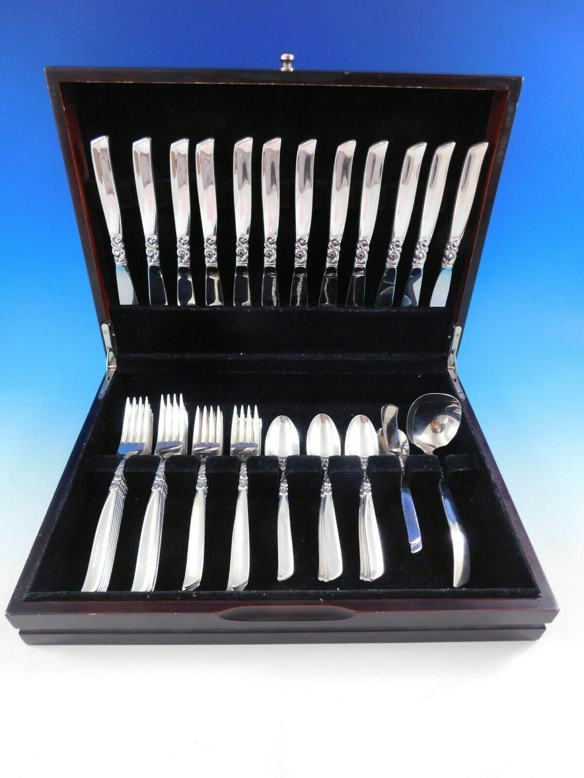 South Seas by Community silverplate flatware set - 51 pieces. This set includes:

12 knives, 8 3/8