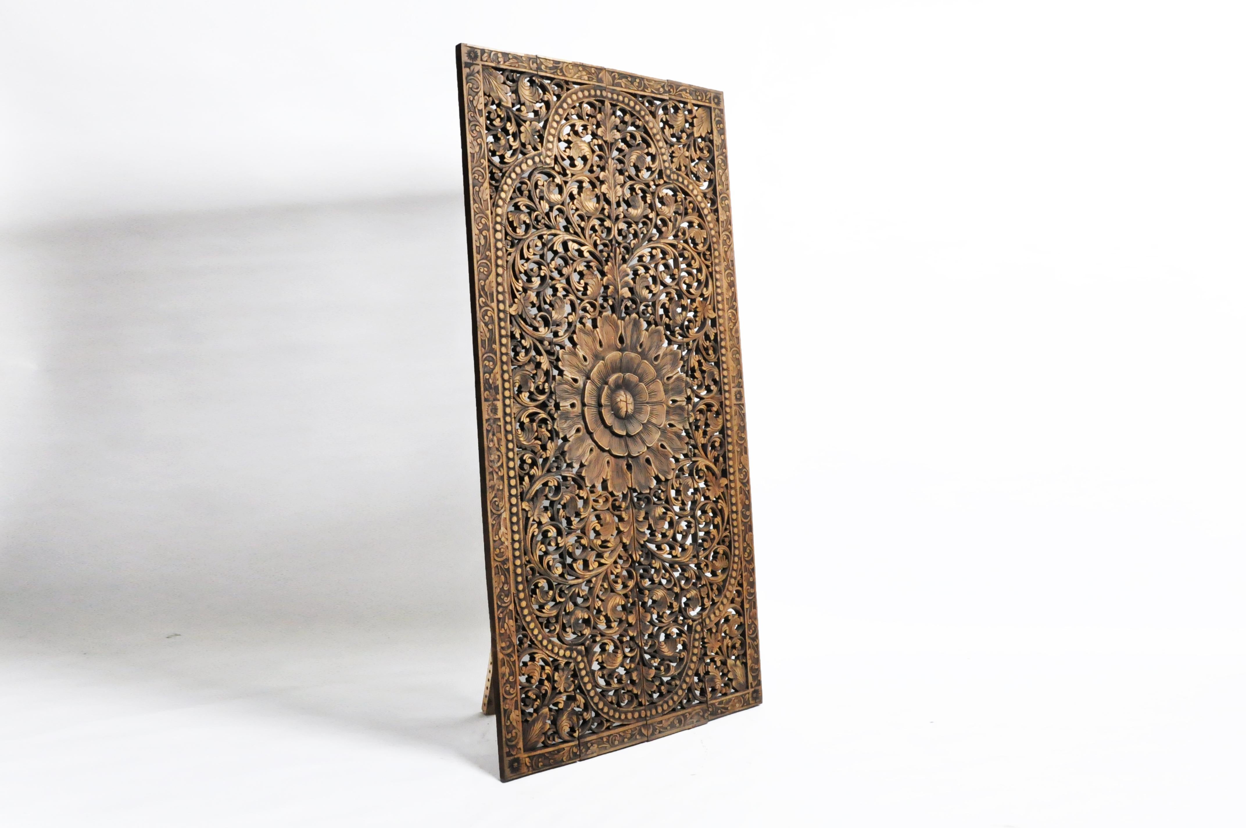 Intricately hand carved, the panel depicts a central medallion of a flower and leaves from Thailand and made from teak wood. Beautiful wall decoration for any room in your home.