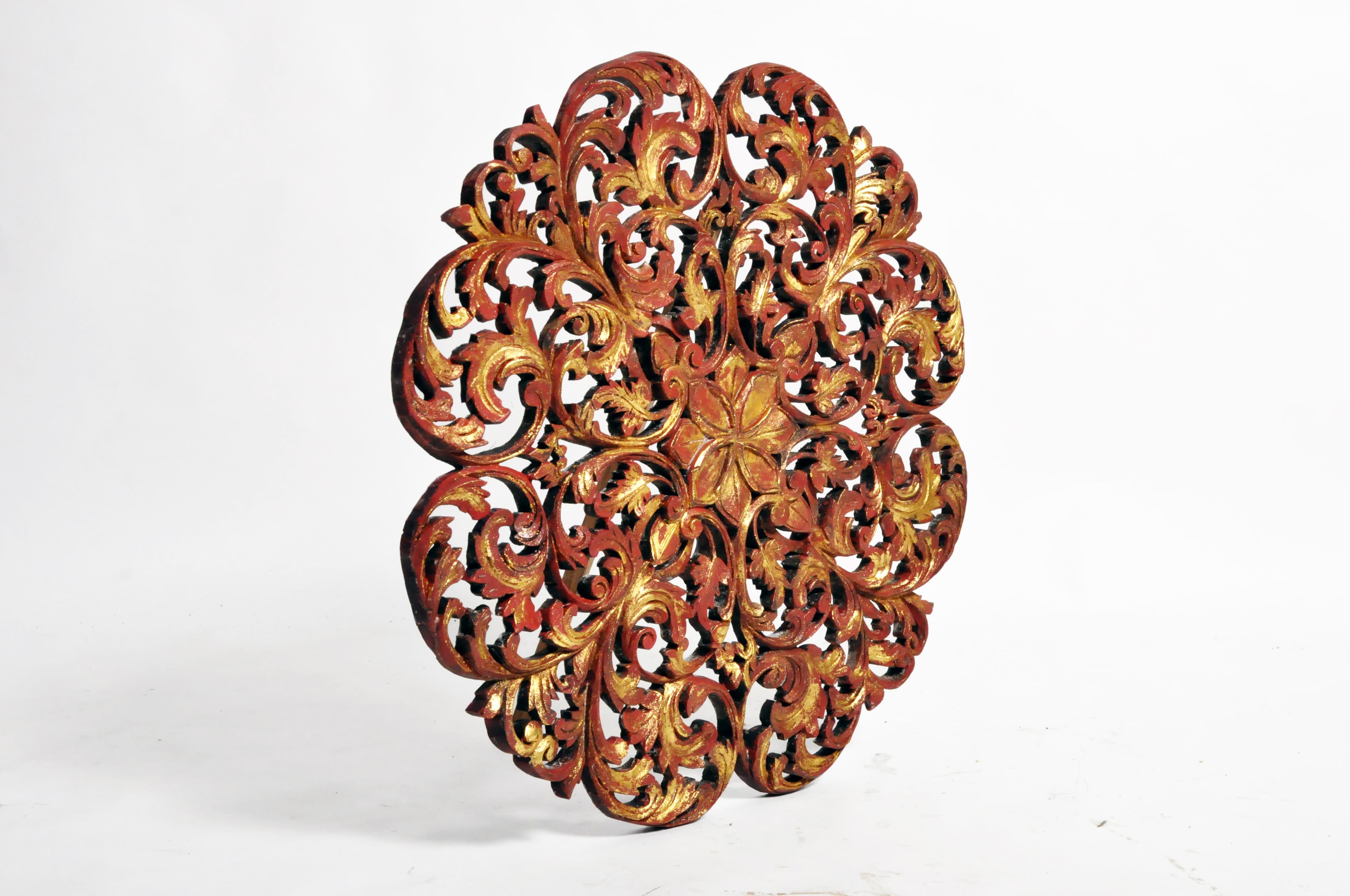 Intricately hand carved, the panel depicts a central medallion of a flower and leaves from Thailand and made from teak wood. Beautiful wall decoration for any room in your home.