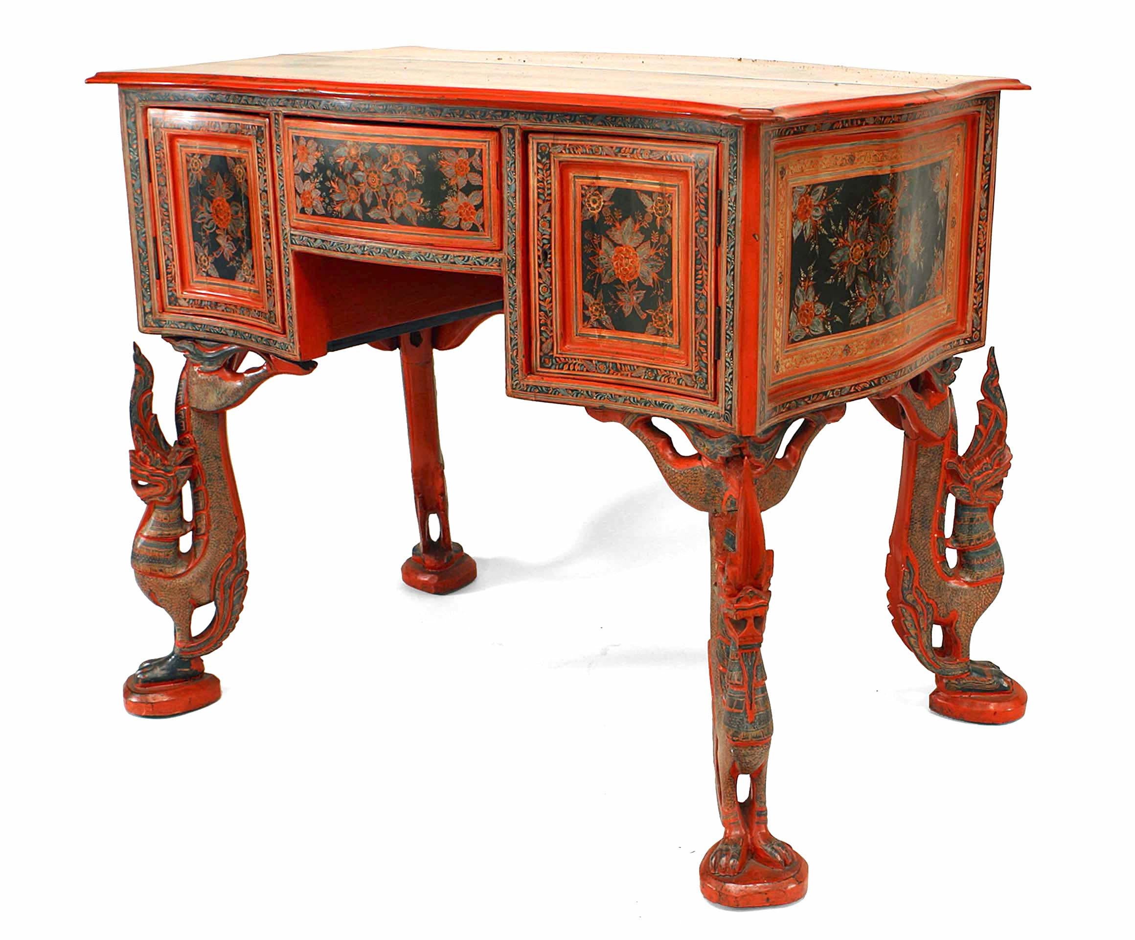Southeast Asian style (19th Century) red lacquer decorated desk with figural bird legs.
