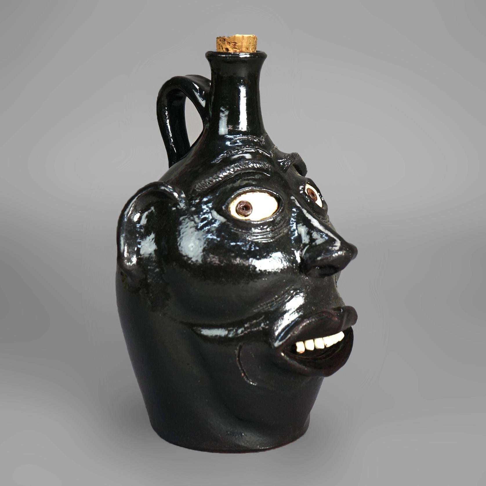 Southern Americana Art Pottery Face Jug signed JH Perdua 20thC

Measures- 11.25''H x 7''W x 7''D