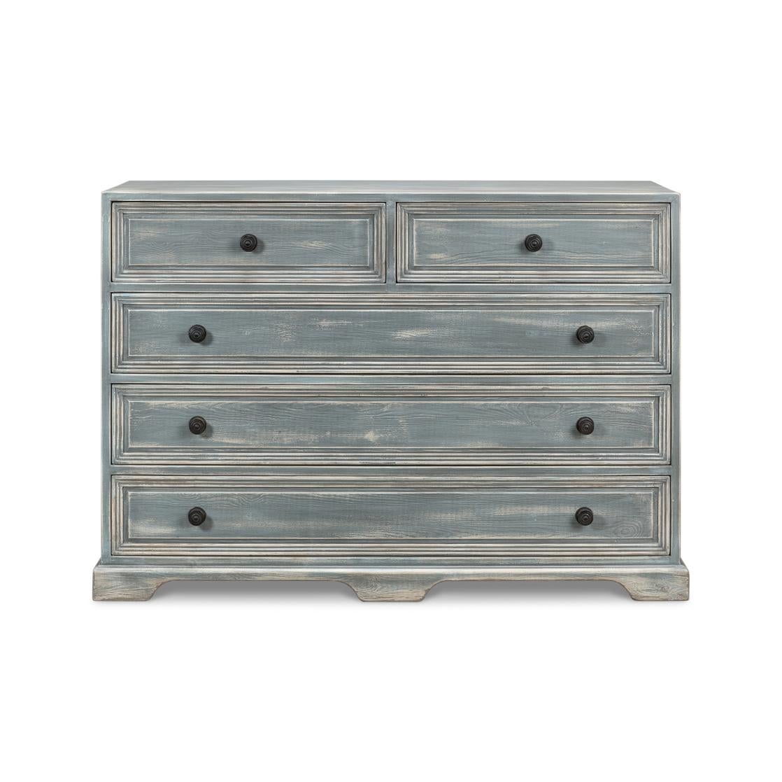 Where the serene hues of the seaside meet the rustic charm of a weathered finish. Providing abundant storage with five self-closing drawers. Constructed of fine pine, finished in a Blue-Grey and adorned with hand-crafted hardware, it is the perfect