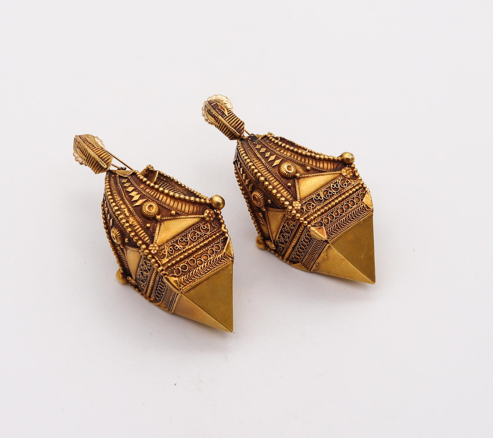 Southern India 19th century dangle earrings

Fabulous, statements oversized dangle earrings, made during the middle of the 19th century in the southern kingdoms of India. These antique earrings have been carefully crafted in three-dimensions in rich