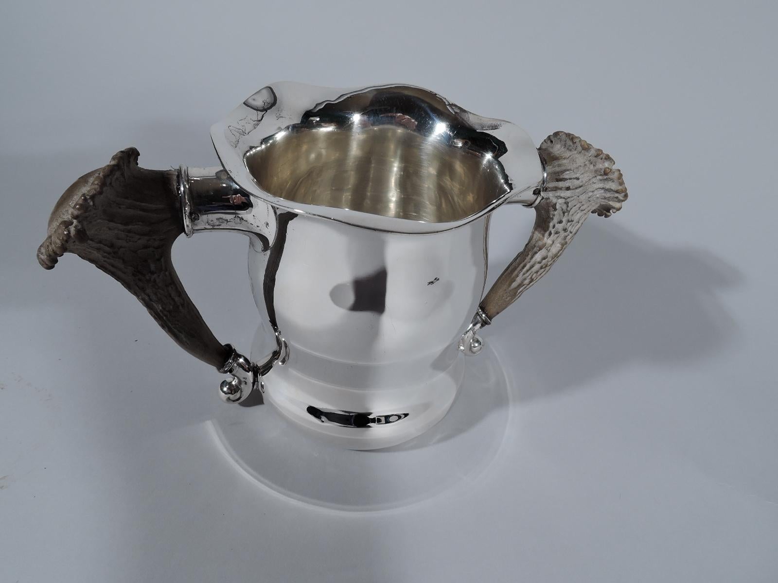 Turn-of-the-century sterling silver trophy cup. Made by Gorham in Providence. Gentle baluster with wavy rim. Antler side handles set in silver mounts. On front engraved presentation in Hebrew-style letters: Thomasville GA / Country Club / Live