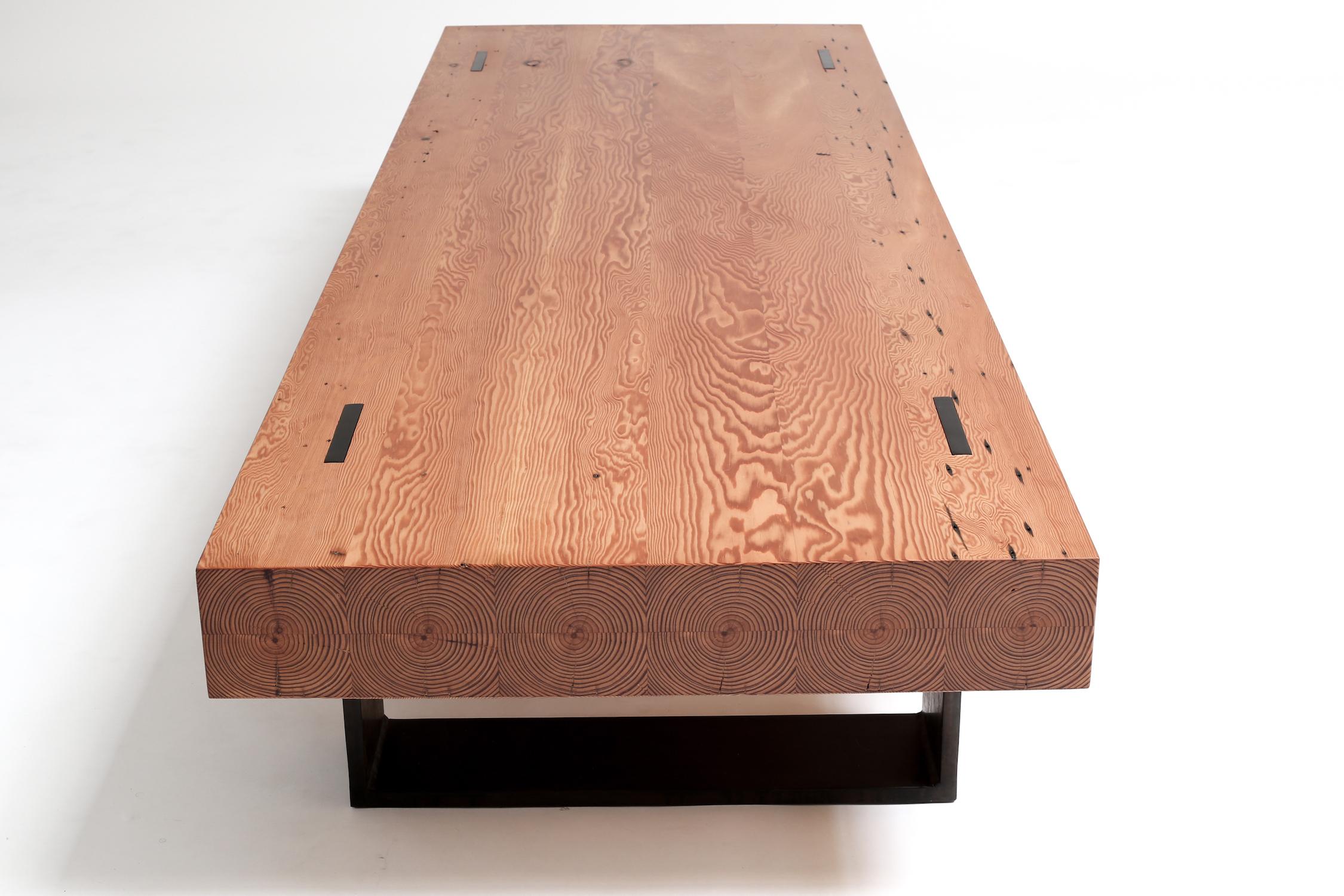 Simple forms create an elegant feel with these reclaimed joists that are supported by a 3/4” thick steel base. Salvaged joists are machined to mimic solid timber, creating a shell that appears to be composed of six square beams. This coffee table