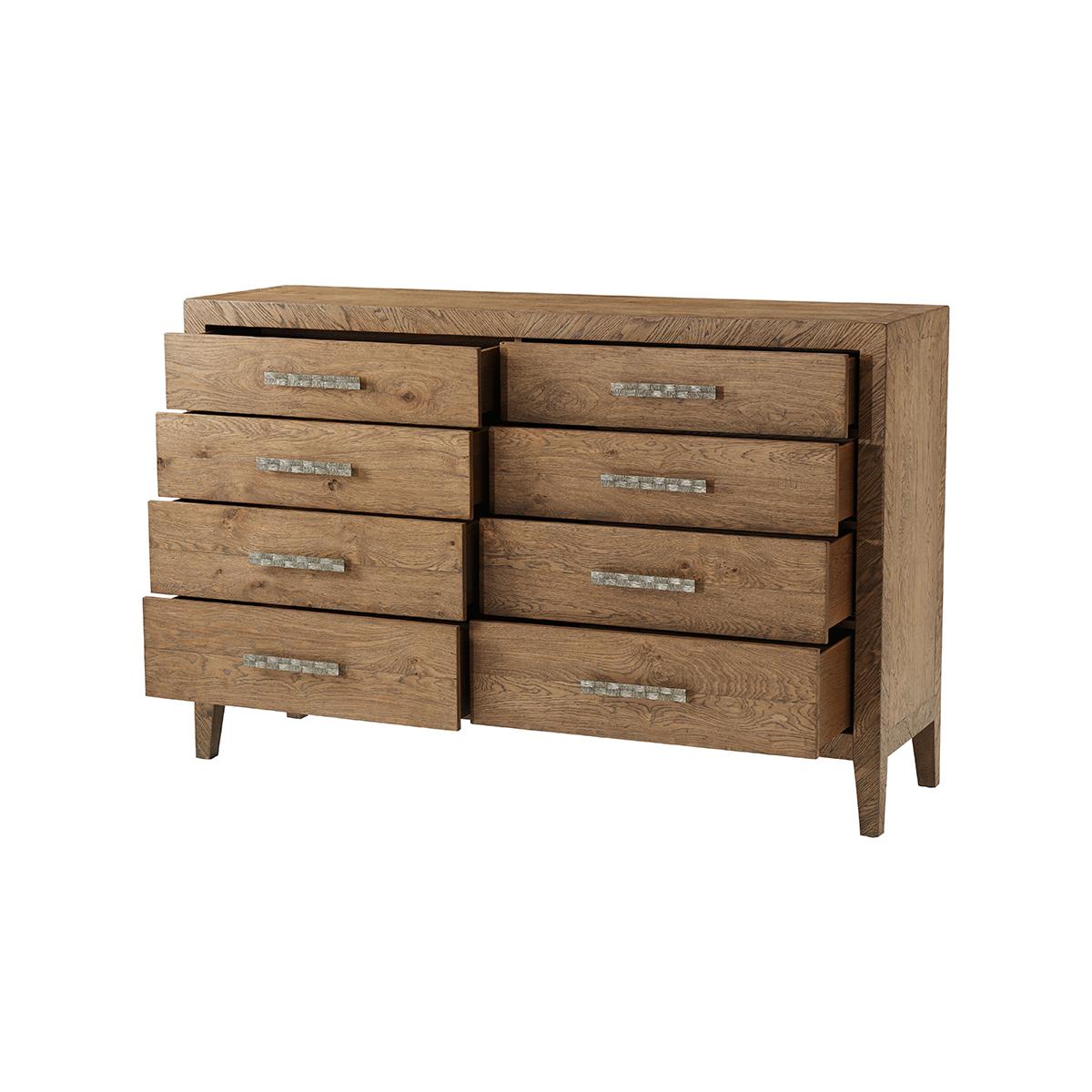 In a light oak finish with a modern tapered leg, adds an interesting and innovative element to any bedroom. Displayed with eight hand-crafted pull-out frieze drawers that are accented by hammered aluminum handles.
Dimensions: 68