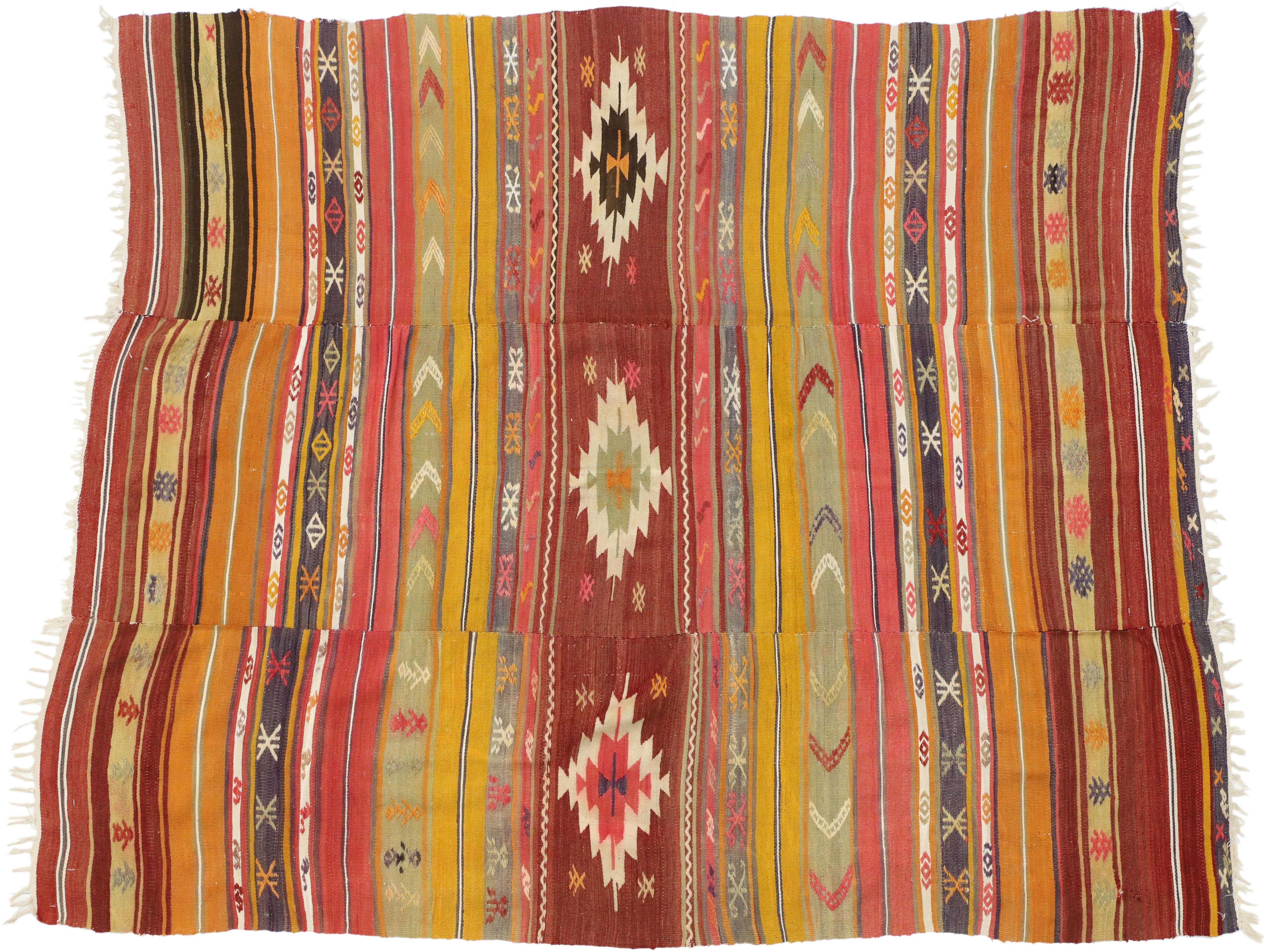 51289 Southwest meets Boho Chic in this vintage Turkish Kilim rug, flat-weave Kilim. This vintage Turkish Kilim rug displays symbolic motifs and bright hues make a statement and create a sense of animation. This Bohemian southwest style Kilim rug is