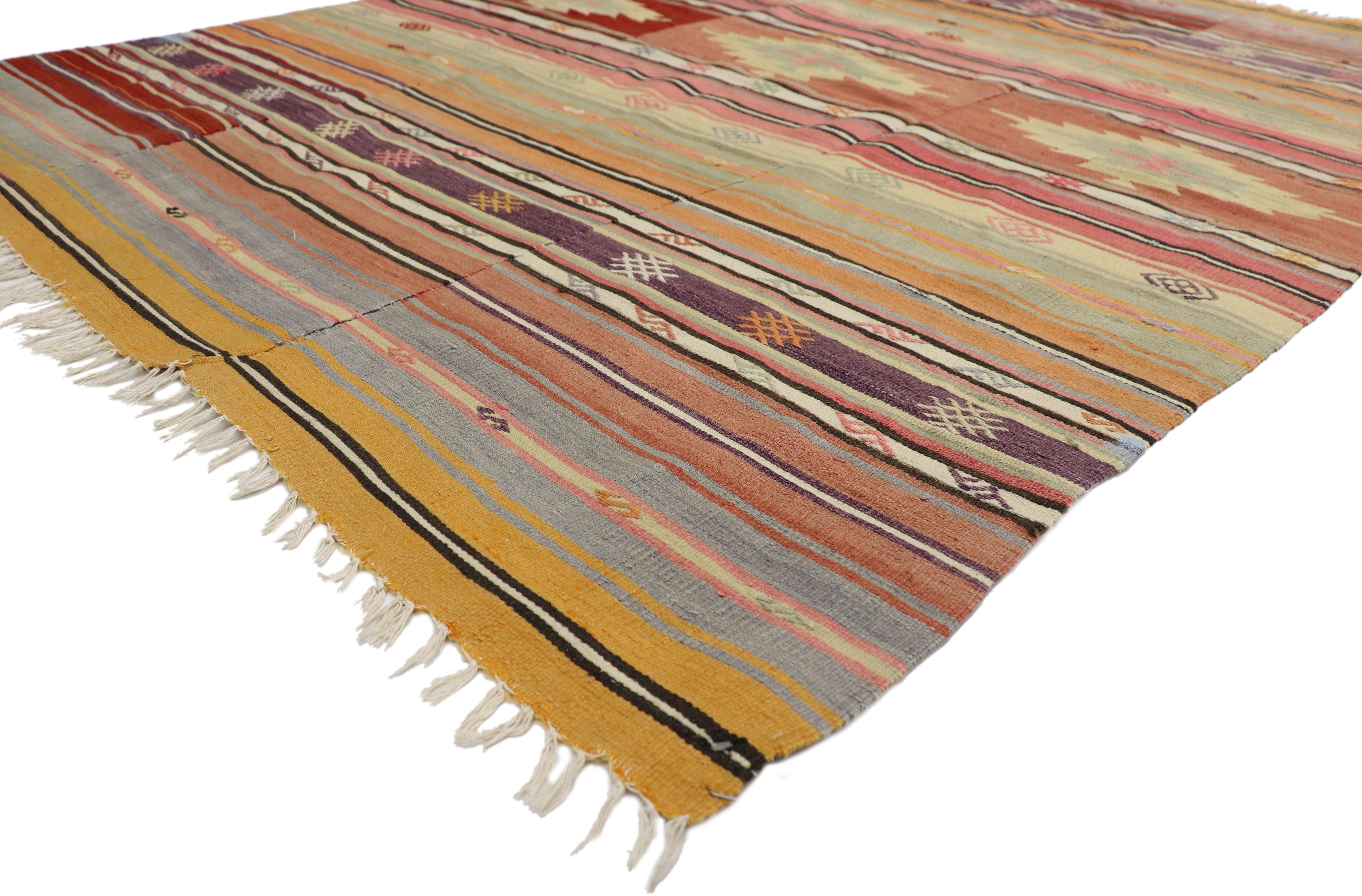51272, Southwest meets boho chic in this vintage Turkish Kilim rug flat-weave Kilim. This vintage Turkish Kilim rug displays symbolic motifs and bright hues make a statement and create a sense of animation. This Bohemian southwest style Kilim rug is