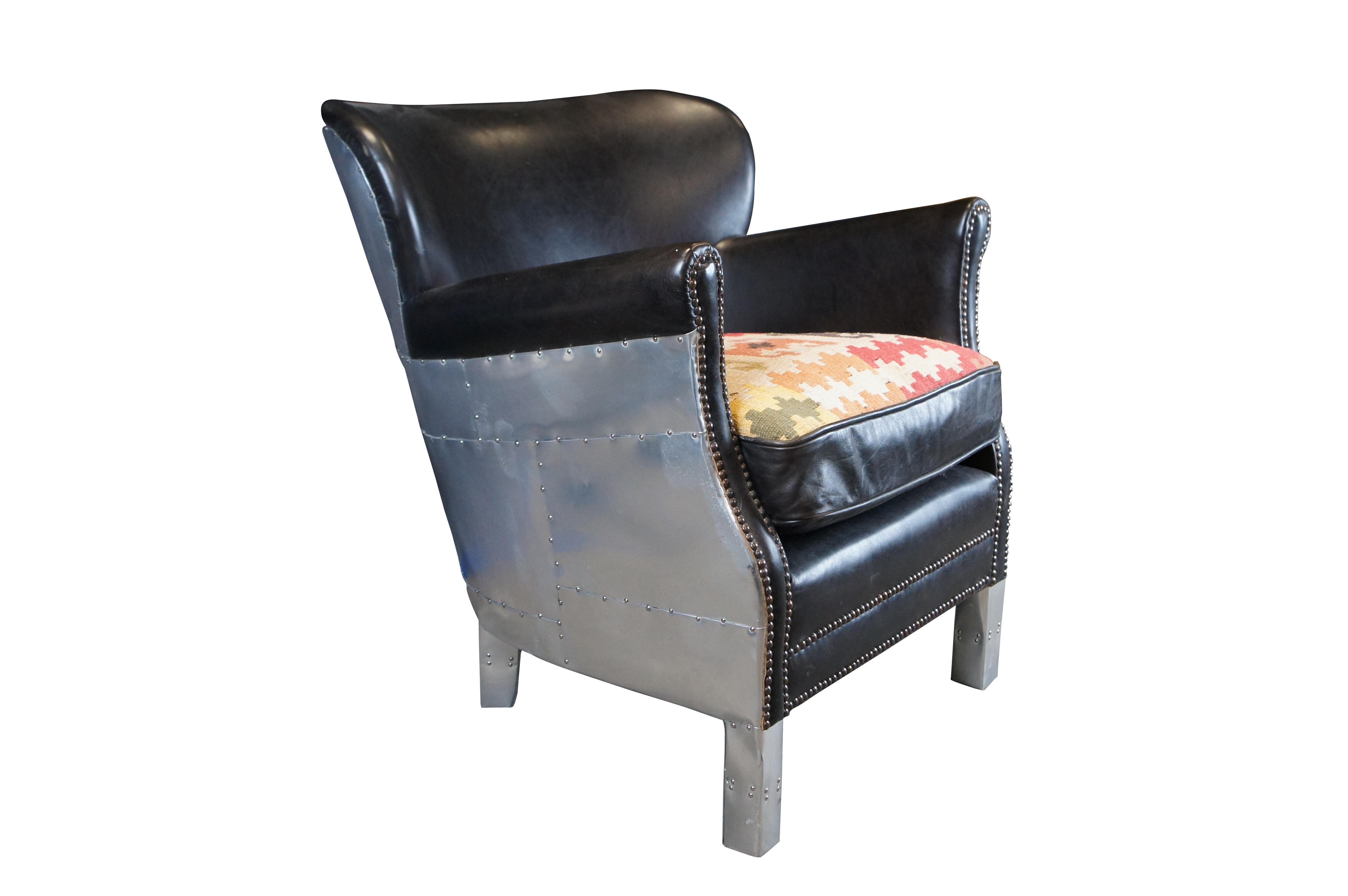 Vintage Southwestern aviator wingback arm chair featuring aluminum paneling, black leather upholstery, and nailhead trim.

The Professor chair offers amazing comfort due to its clever contouring. The smaller proportions work perfectly in any entry