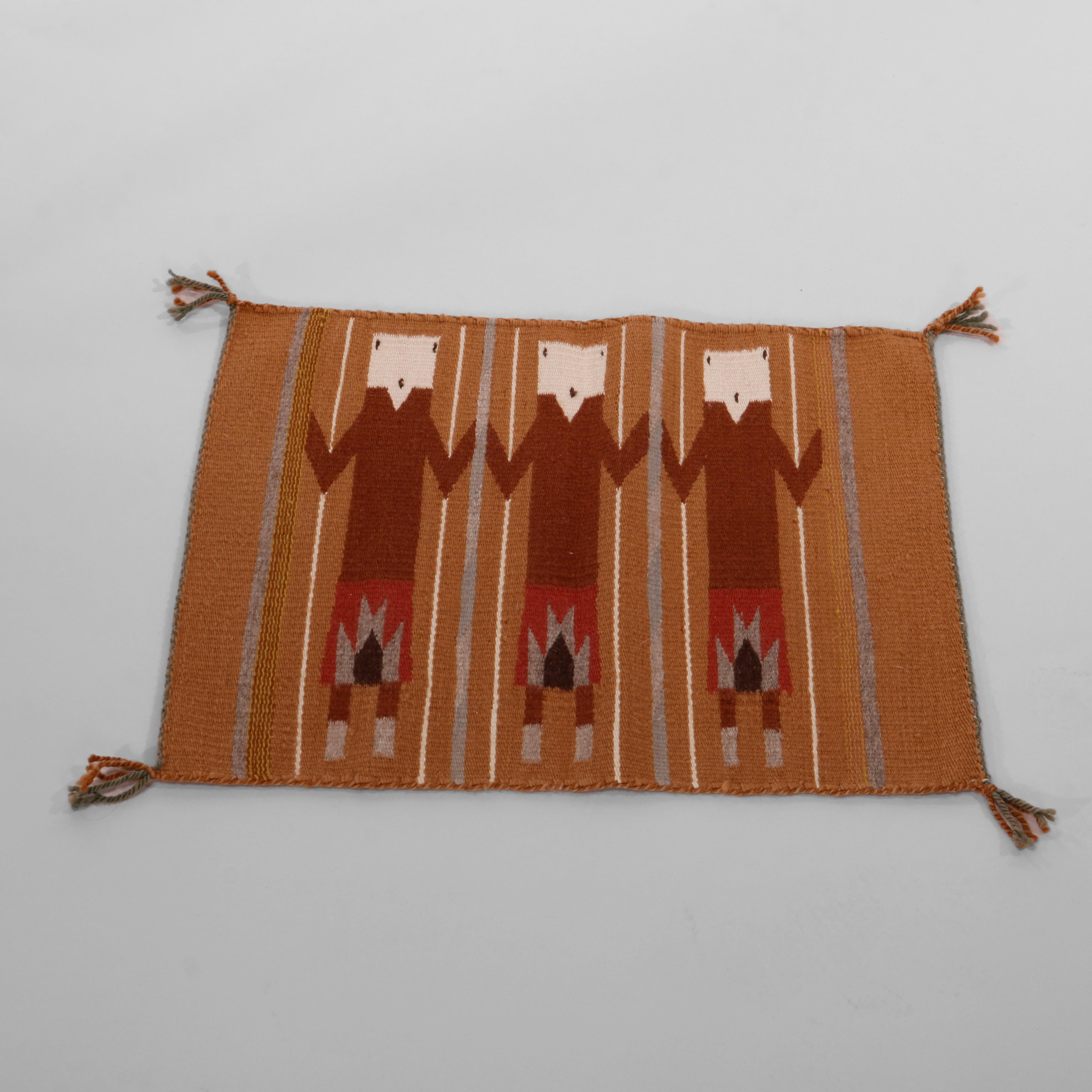 A Southwestern Native American Indian Navajo Yei rug offers hand woven wool construction with design having three figures, reminiscent of foxes, 20th century

Measures - 21.75''L x 17'' W x .5'' D.

Catalogue Note: Ask about DISCOUNTED DELIVERY