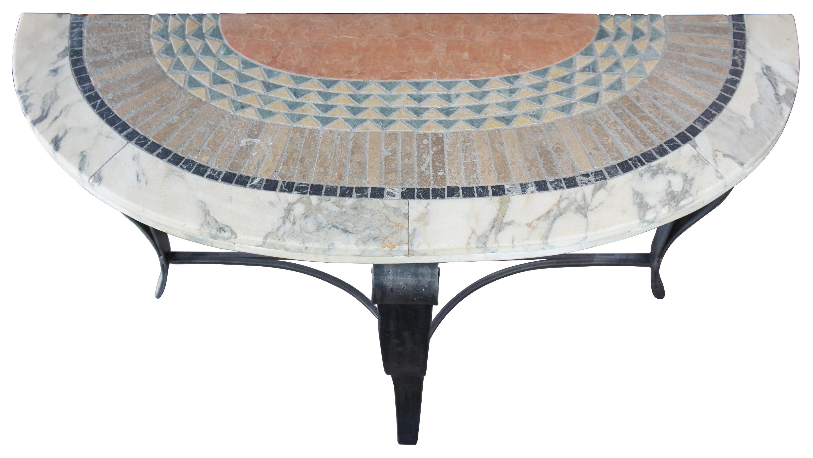 Vintage Southwestern style demilune console or entry table. Features a half round shape with geometric mosaic tiled stone top and scrolled iron base. Very heavy.
 