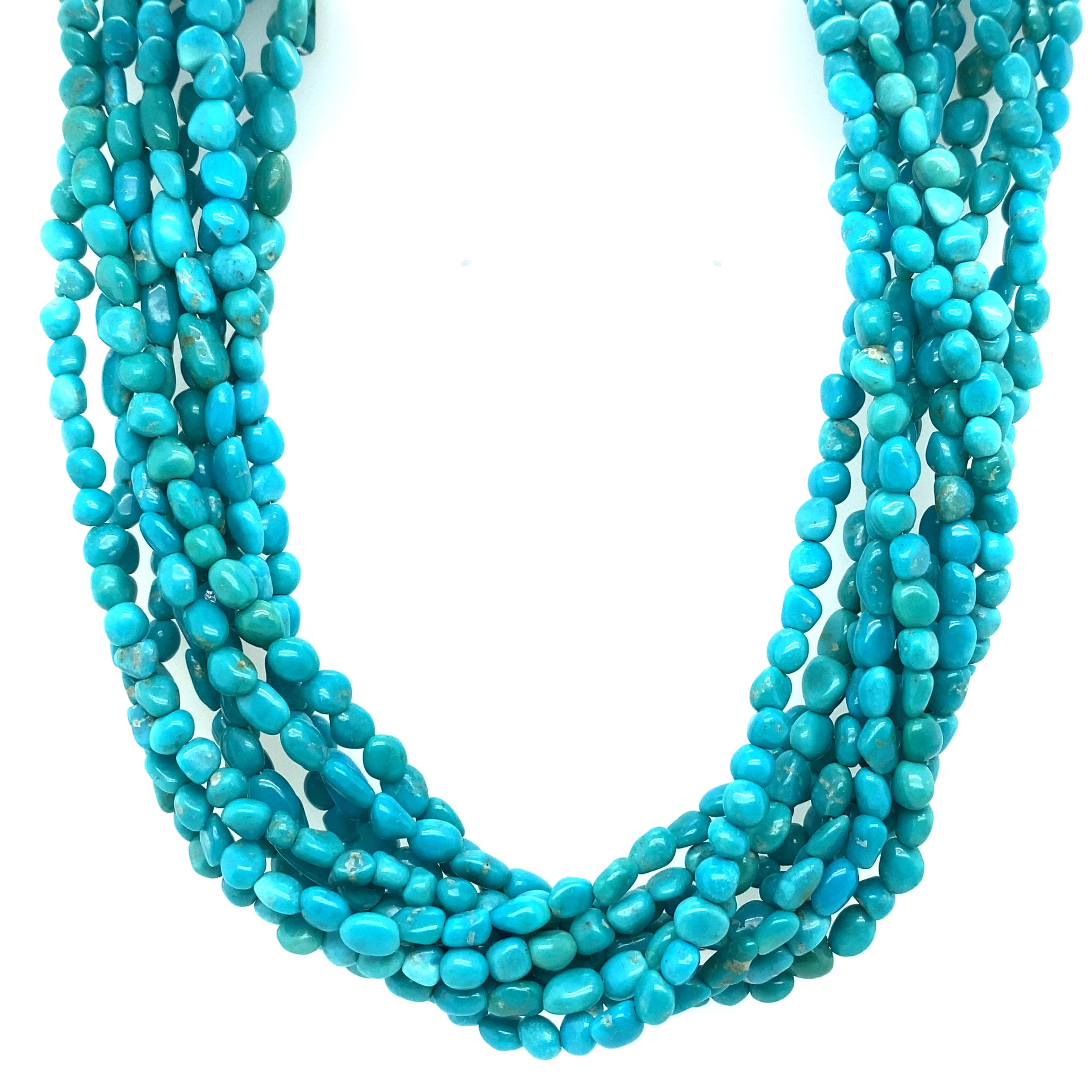 Item Details: This vintage necklace has twisted strands of vibrant turquoise with a sterling silver clasp. It is a gorgeous Southwestern style piece for any collector of turquoise jewelry.

Circa: 1970s
Metal Type: Sterling silver
Size: 22 inch