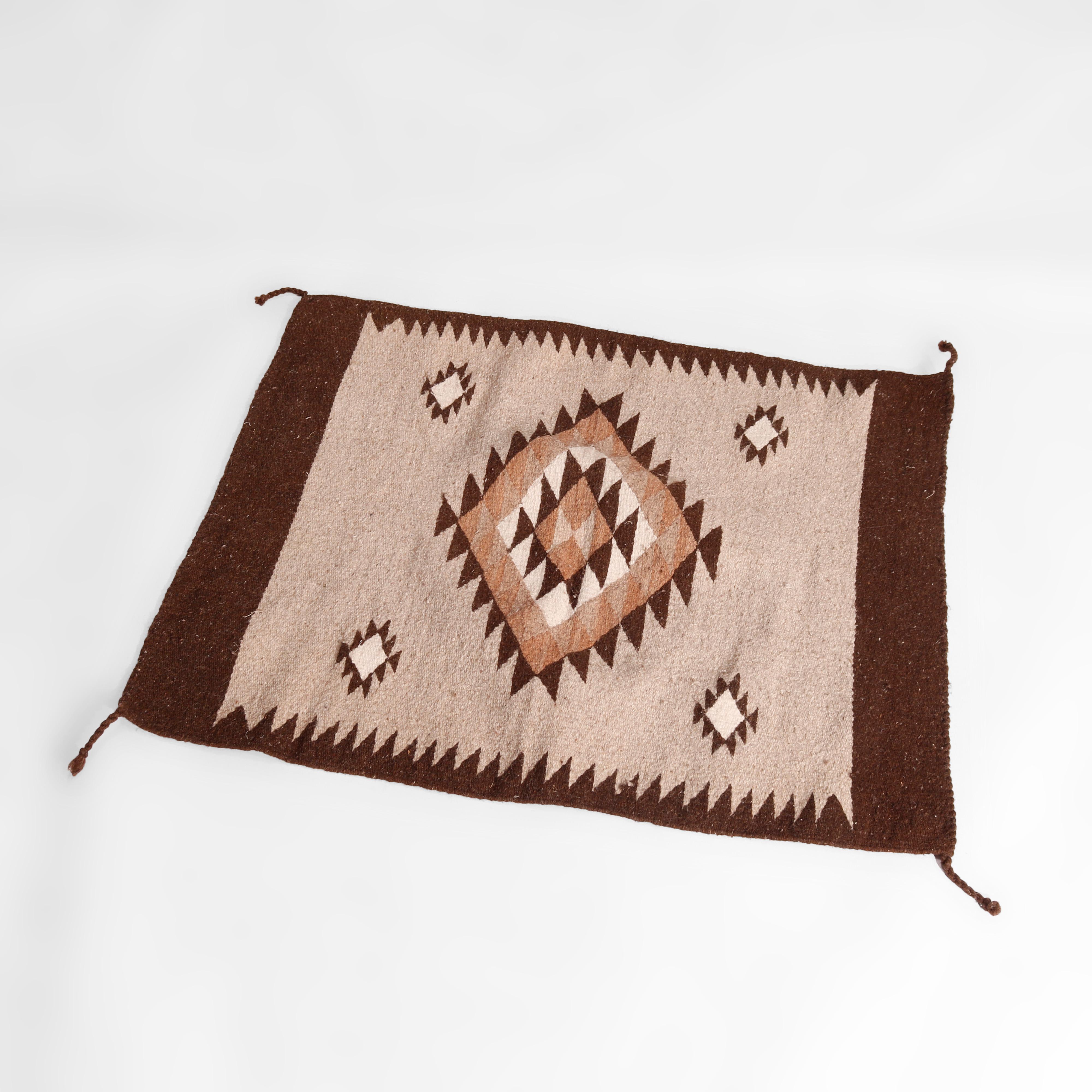 An antique southwestern native American Indian Navajo style rug offers wool construction with central diamond medallion c1920

Measures- 35.25''L x 29.5''W x .5''D.

Catalogue Note: Ask about DISCOUNTED DELIVERY RATES available to most regions