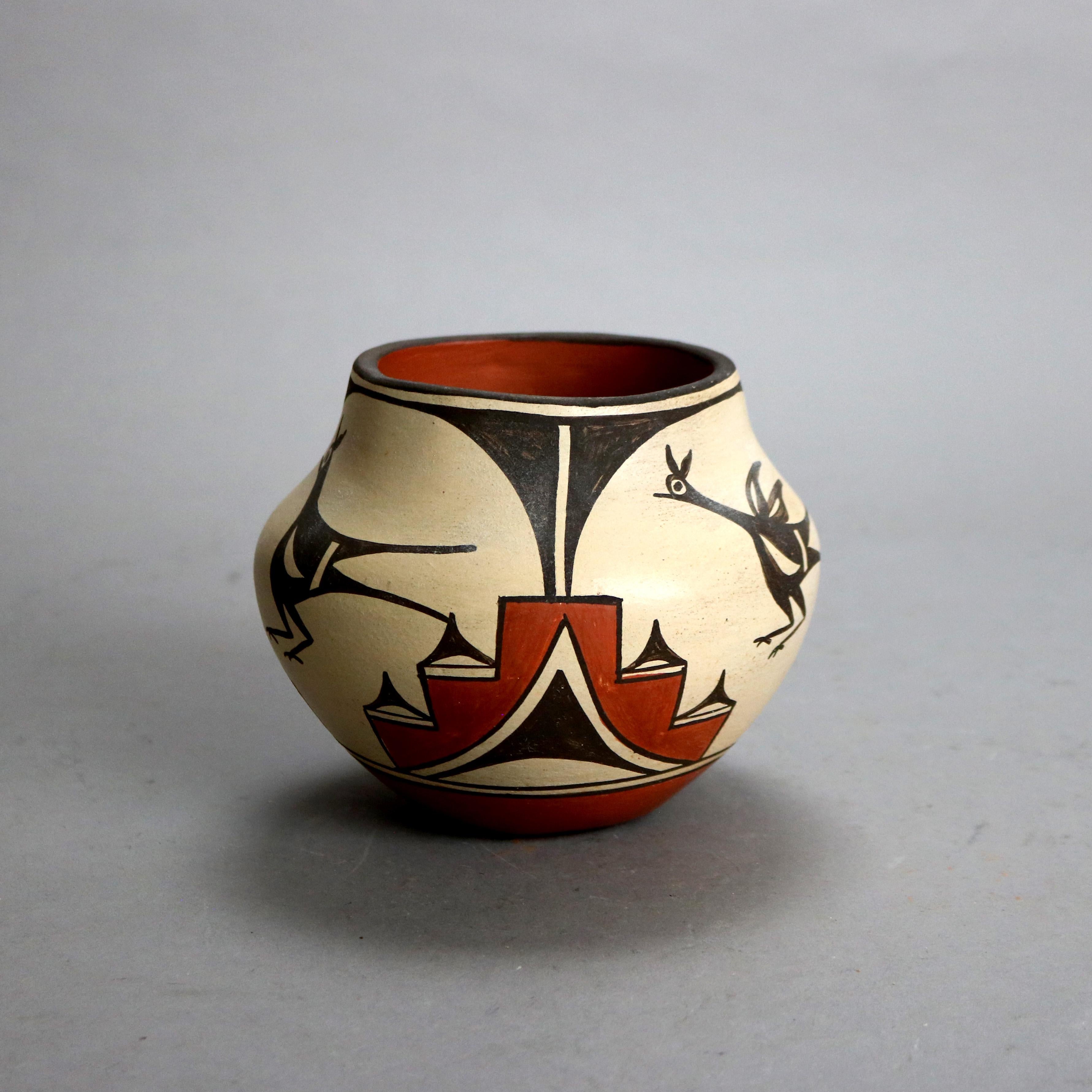 Southwestern Native American Zia Pueblo Pottery Vase with Bird by E Medina 20thC

Measures - 5 1/8