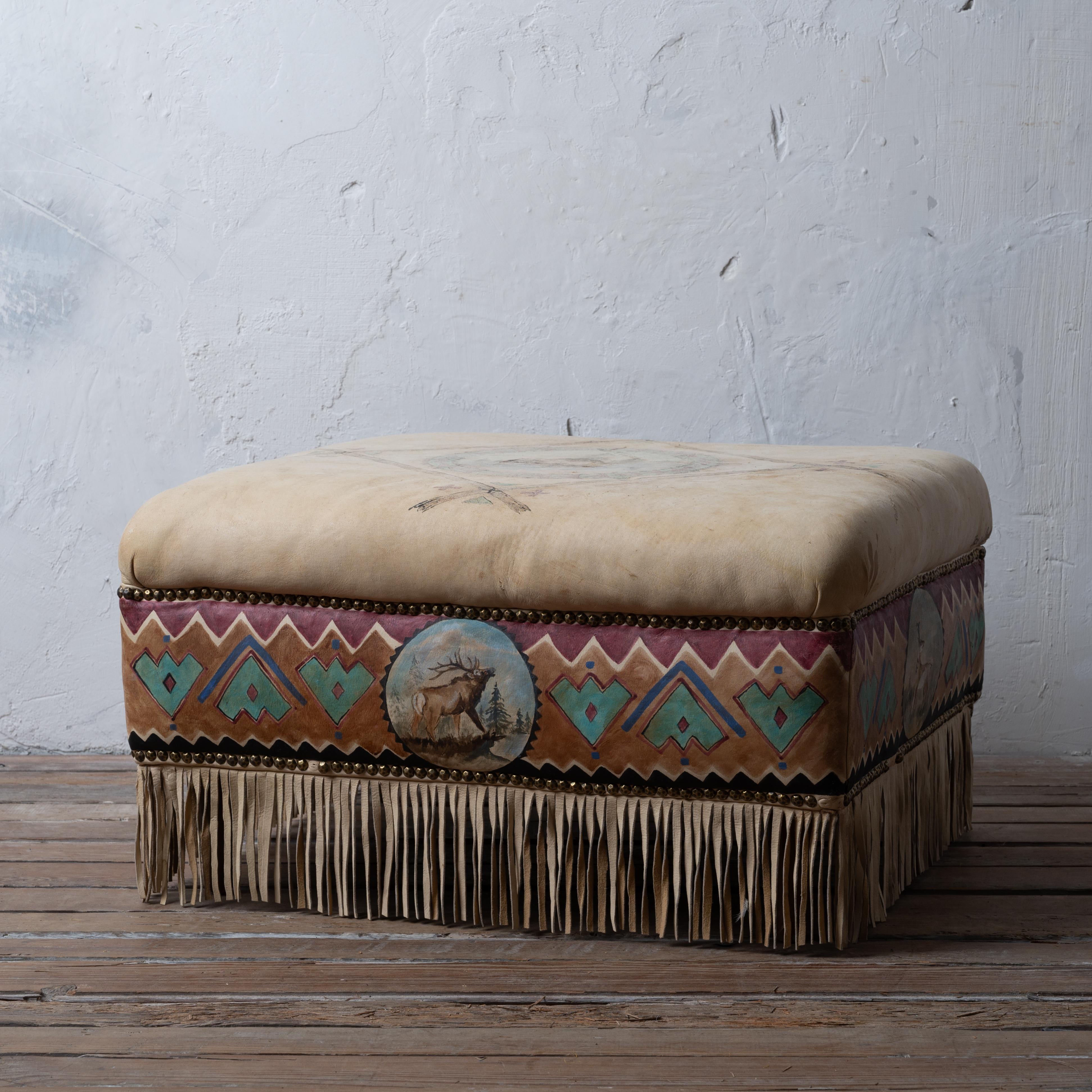 A southwestern painted buckskin ottoman by artist Zona Pilgreen.

27 ½ inches wide by 23 ½ inches deep by 15 ½ inches tall 

