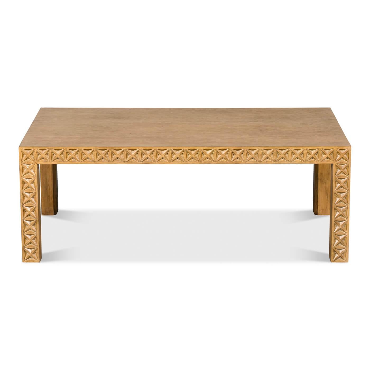 A southwestern-style carved leg coffee table crafted in oak. The rails and legs feature a chip-carved geometric design.

A beautiful piece that highlights a hand-carved design that can be admired from all angles. 

Dimensions: 47
