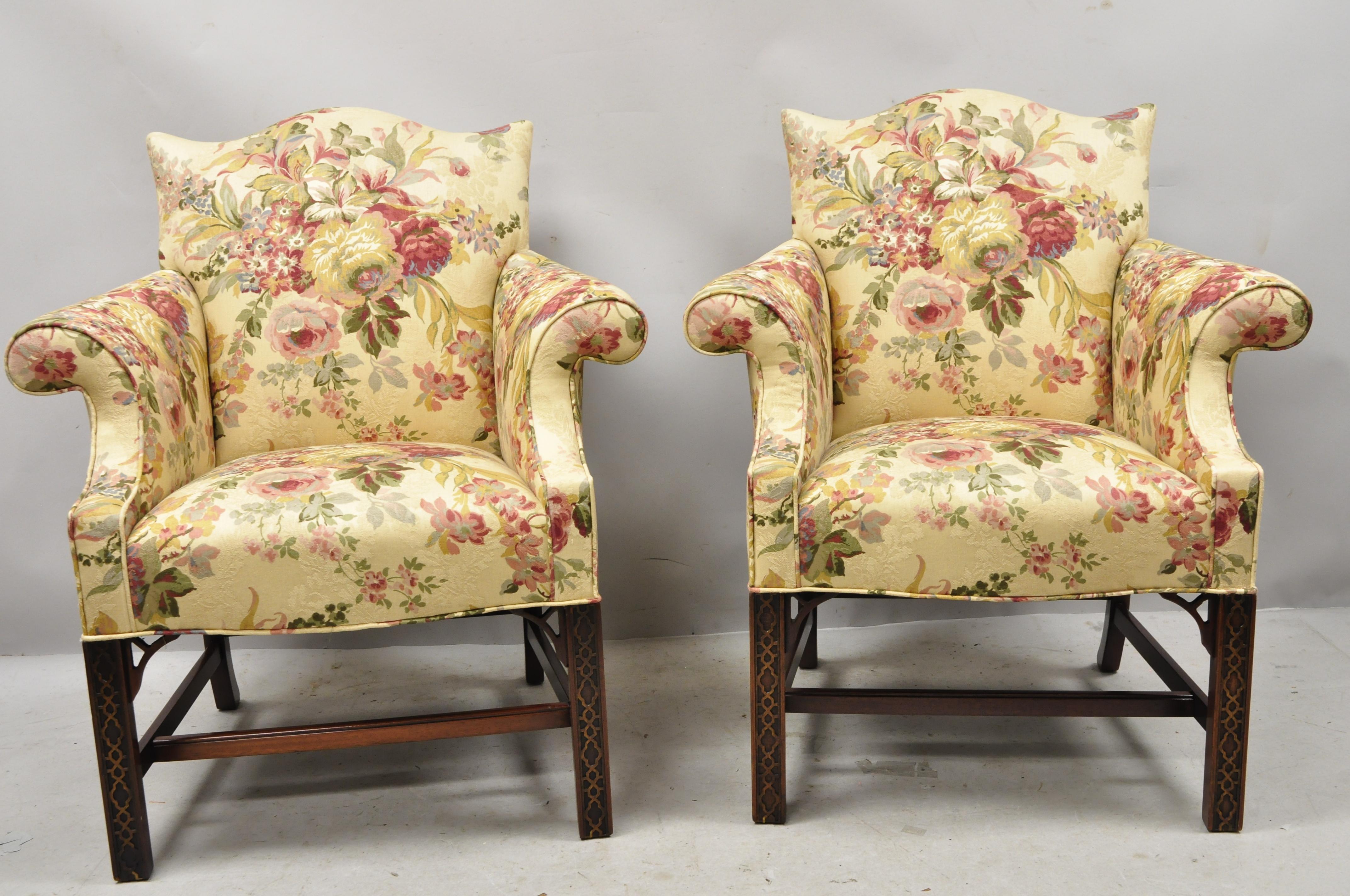 Southwood Chinese Chippendale carved fretwork legs lounge armchairs - a pair. Item features stretcher base, carved fretwork legs, rolled arms, upholstered seats, solid wood frame, beautiful wood frame, nicely carved details, quality American