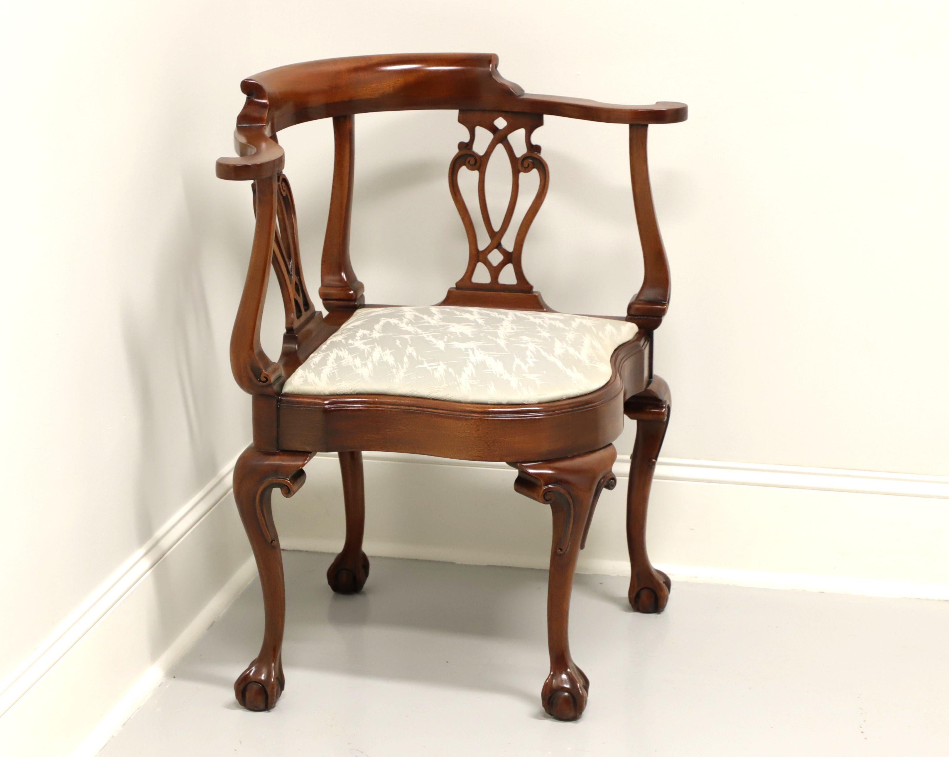 A Chippendale style corner chair by Southwood Furniture. Solid mahogany, carved backrest, gray & white color shimmery fabric upholstered seat, cabriole legs, and ball in claw feet. Made in North Carolina, USA, in the late 20th Century. 

Measures: