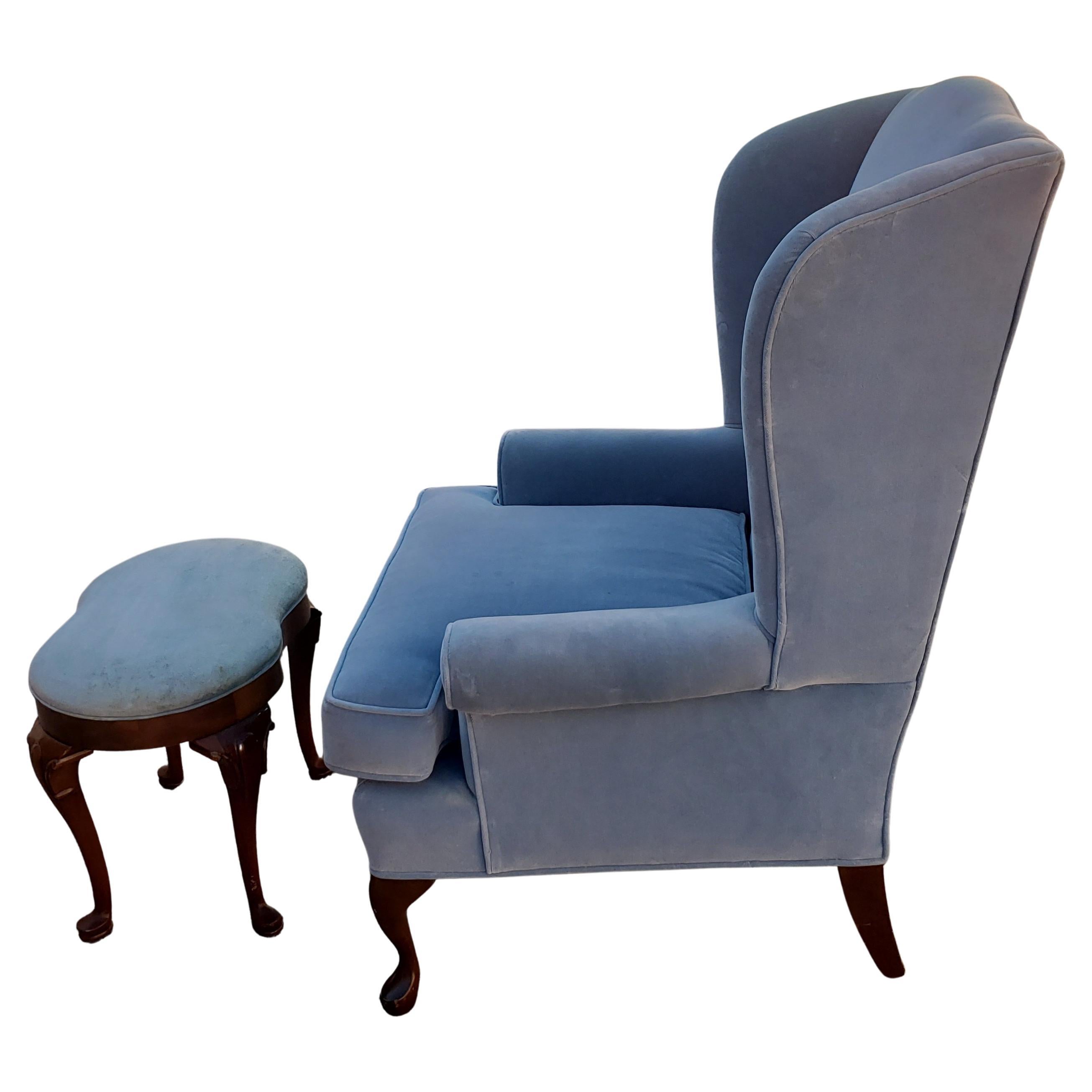 Amazingly well kept wingback chair by Southwood and Co. Original French blue velvet upholstery in very good condition and clean. No stains and extremely minimal wear. Very soft and very comfortable. Chair was used with cover all the time. Ottoman
