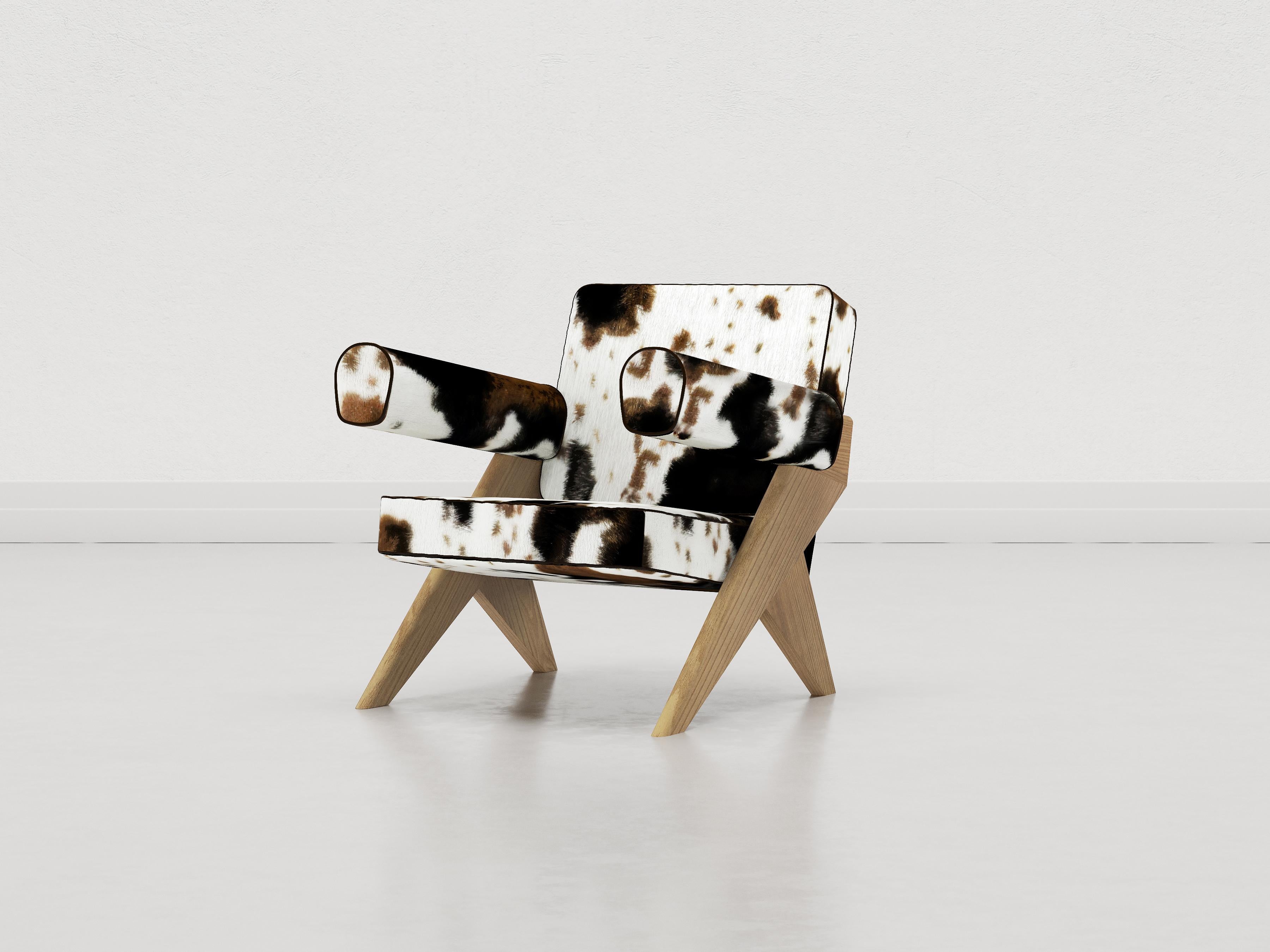 Souvenir armchair is composed of two structural sides in sandblasted Elm wood finished with a matte lacquer, natural or dark. 
The seat and backrest are padded with polyurethane foam and entirely covered in fabric or leather.

This configuration of