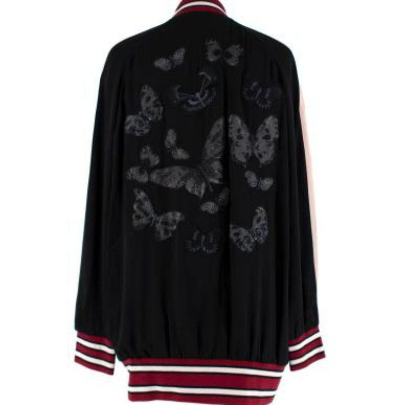 Valentino Souvenir Black Butterfly Embroidered Bomber Jacket
 
 
 
 - Fluid silk crepe body 
 
 - Embroidered butterfly pattern 
 
 - Pink silk chiffon arm panels 
 
 - Burgundy and white stripe knit collar, cuffs and hem 
 
 - Slip pockets 
 
 -