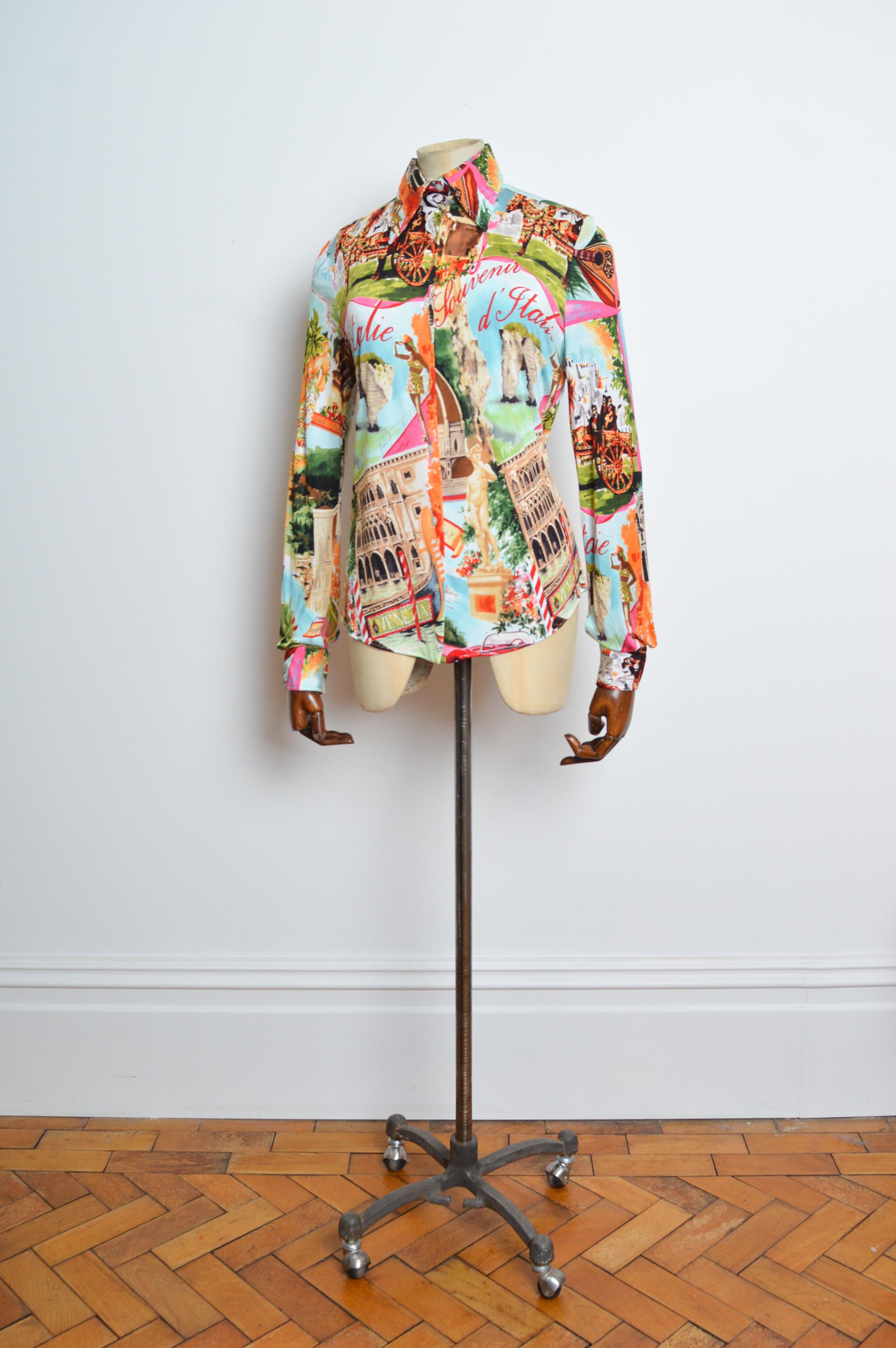 Souvenirs of Sicily DOLCE & GABBANA Colourful fitted blouse - Italian Postcard Shirt.
Features; Sublime rayon printed blouse depicting scenic postcard images of the Italian riviera by DOLCE & GABBANA Circa 2000. 
MADE IN ITALY.
Recommended Size; UK