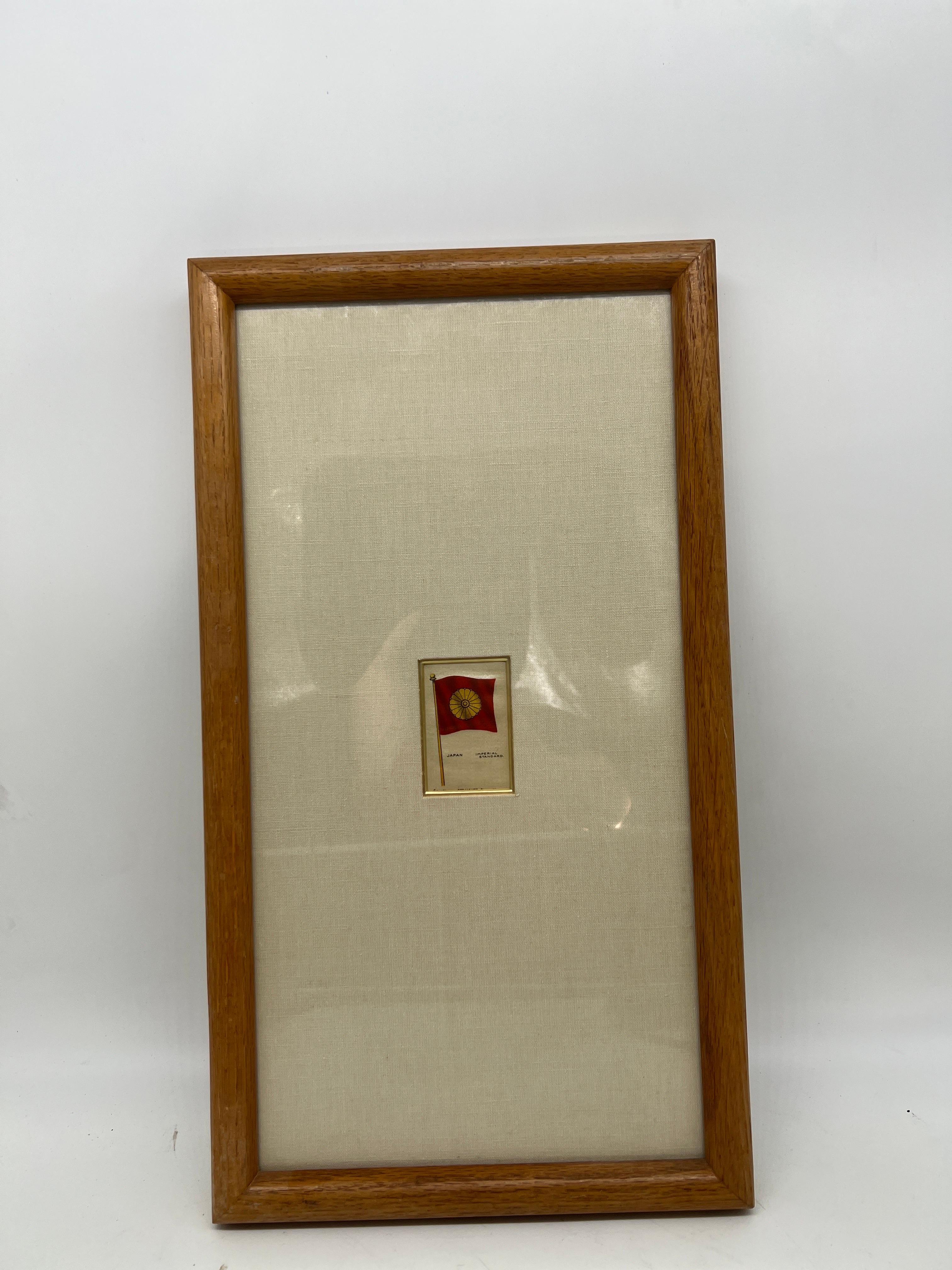 Sovereign Cigarettes, circa 1910.

A framed antique silk cigarette card circa 1910 featuring one of the 126 piece series of country flags. This one showcases the Imperial Standard Japanese flag. In a fine quality frame and matte.