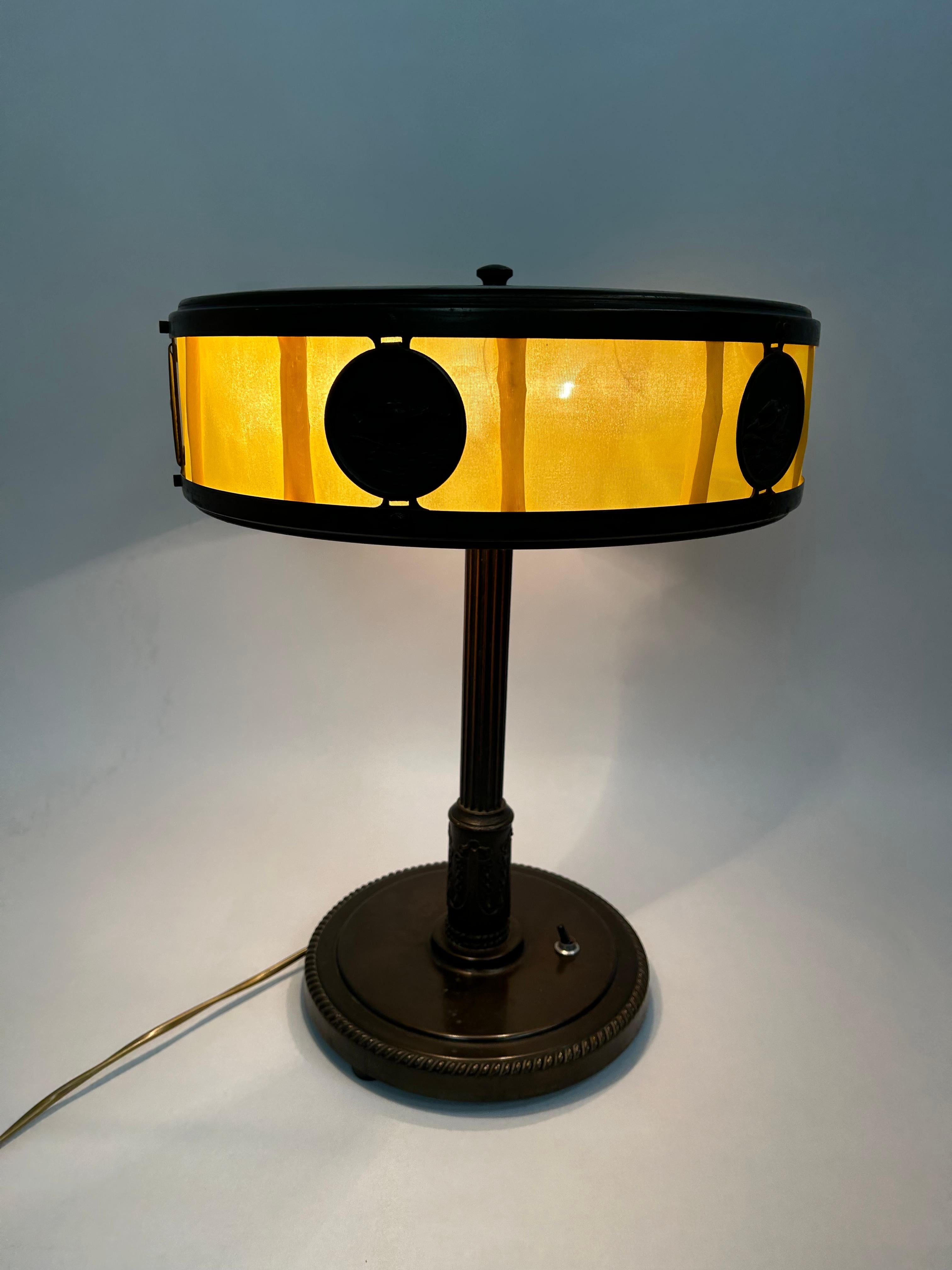 Soviet admiral desk lamp with yellow fabric. Very same lamp with green fabric is located in Stalin's bunker in Samara. 