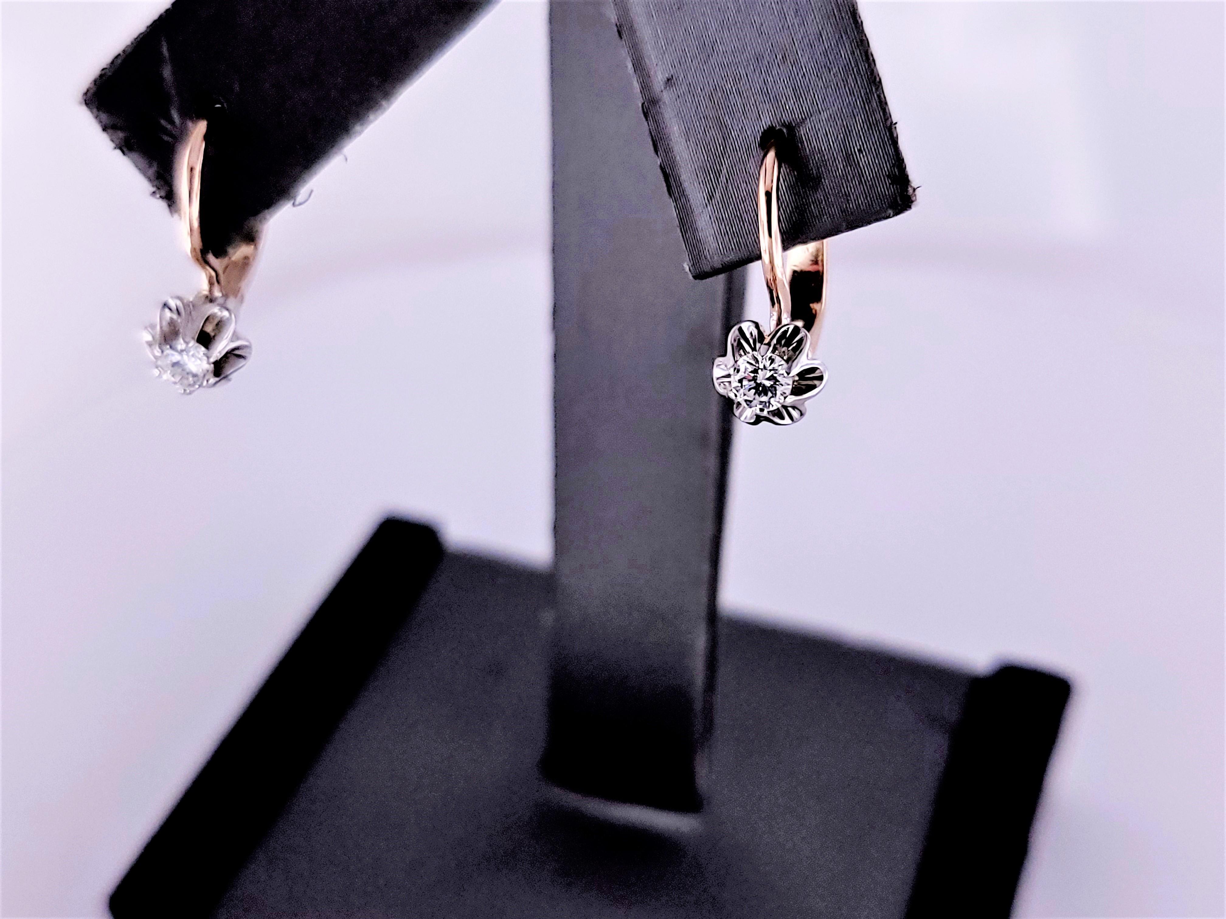 These stunning Russian soviet earrings are crafted in 14K Rose & White gold, showcasing the elegance and unique charm of vintage Soviet-era design. The soft, warm hue of the rose & white gold lends a subtle, romantic glow that complements any skin