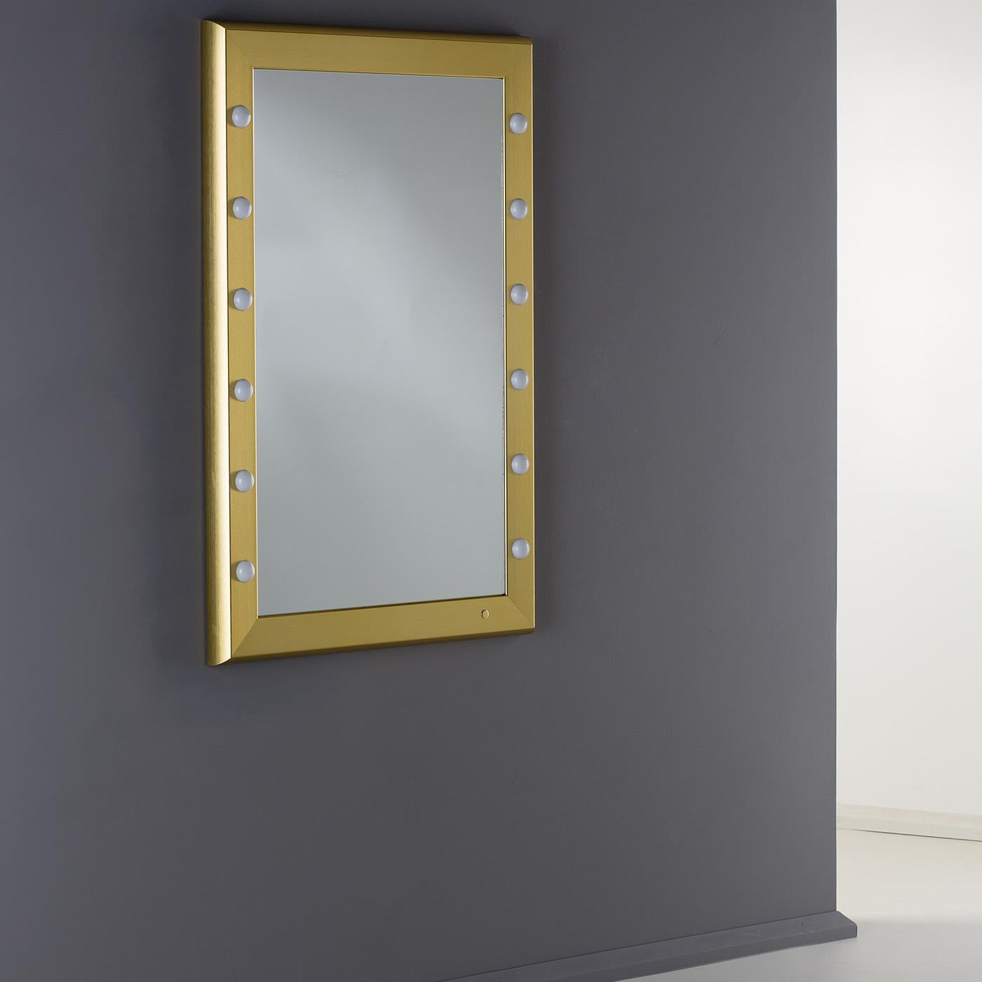This stunning lighted mirror exemplifies modern luxury with its impeccable craftsmanship and attention to detail designed to bring functional style to luxury interiors. Part of the SP series, this wall mirror features a polished gold anodized