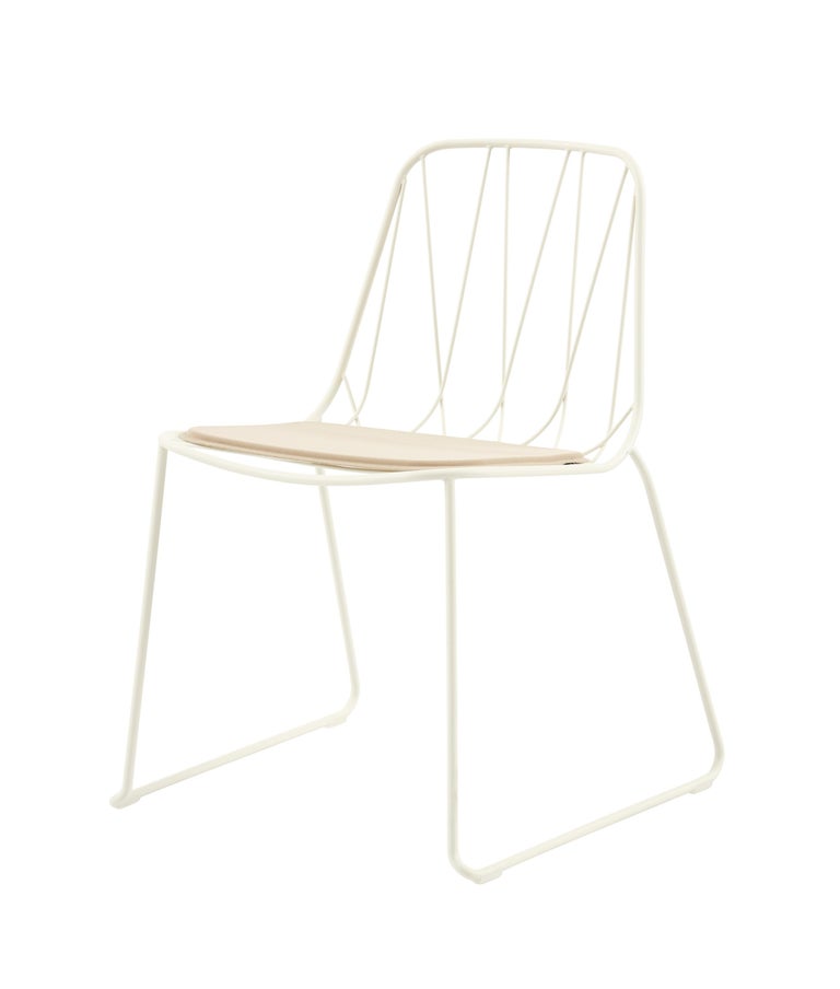 Chee is an ornate but contemporary bent wire chair collection designed for comfort. 

The overlapping metal wires curve out from the frame to create a striking geometric web. This bent wire web supports the back and forms a seat that is both