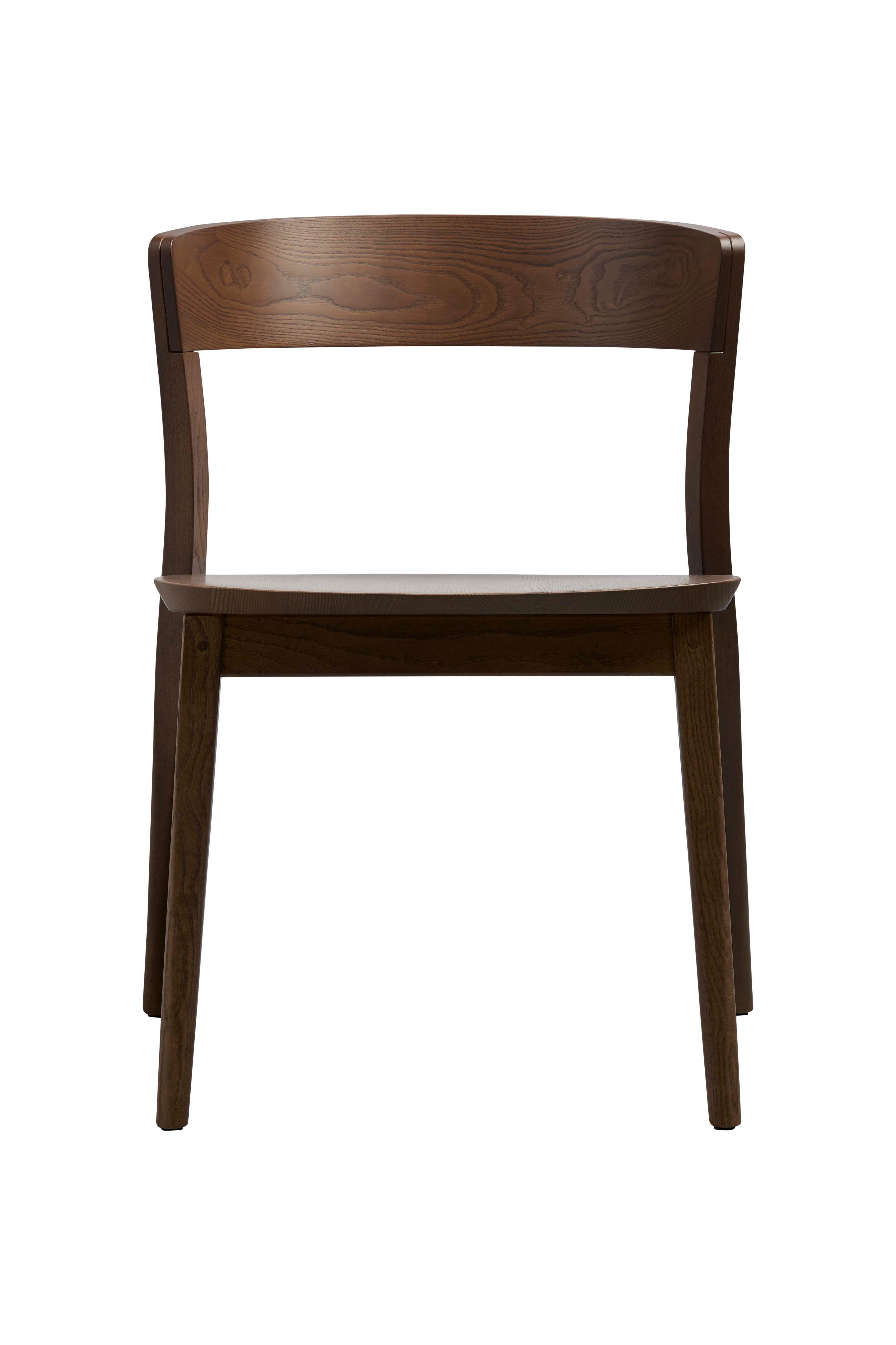 Contemporary interpretation of the classic bistro chair, Clarke was designed for comfort. Made from solid ash, this sculpted piece is defined by fine details and subtle curves and angles. Fine craftsmanship highlights the sculpted solid timber seat