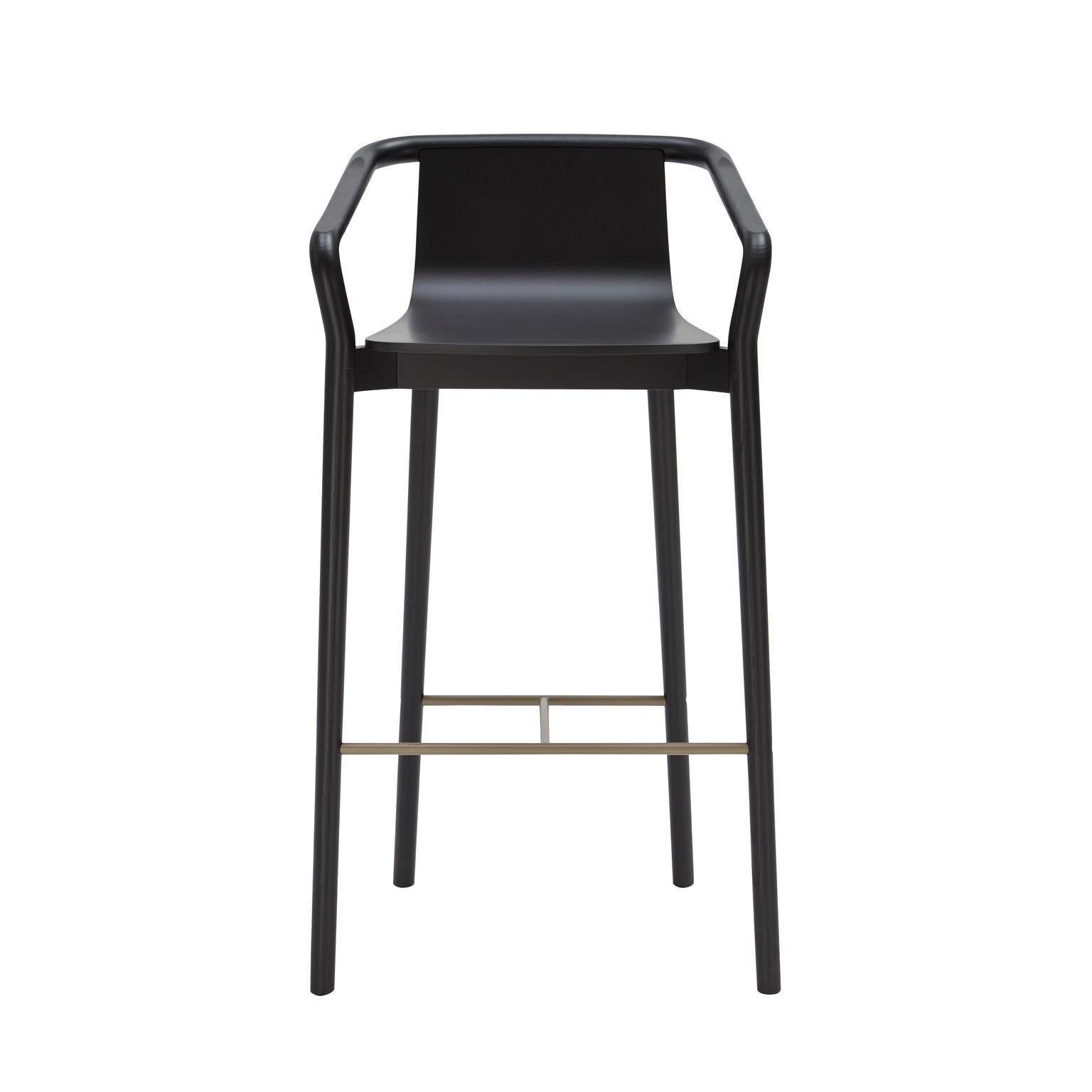 The Thomas barstool completes the Thomas Family and is derived from the same design elements that define the series. Featuring a formed plywood shell suspended in a solid ash frame with the distinctive carved armrest detail, the stool features a