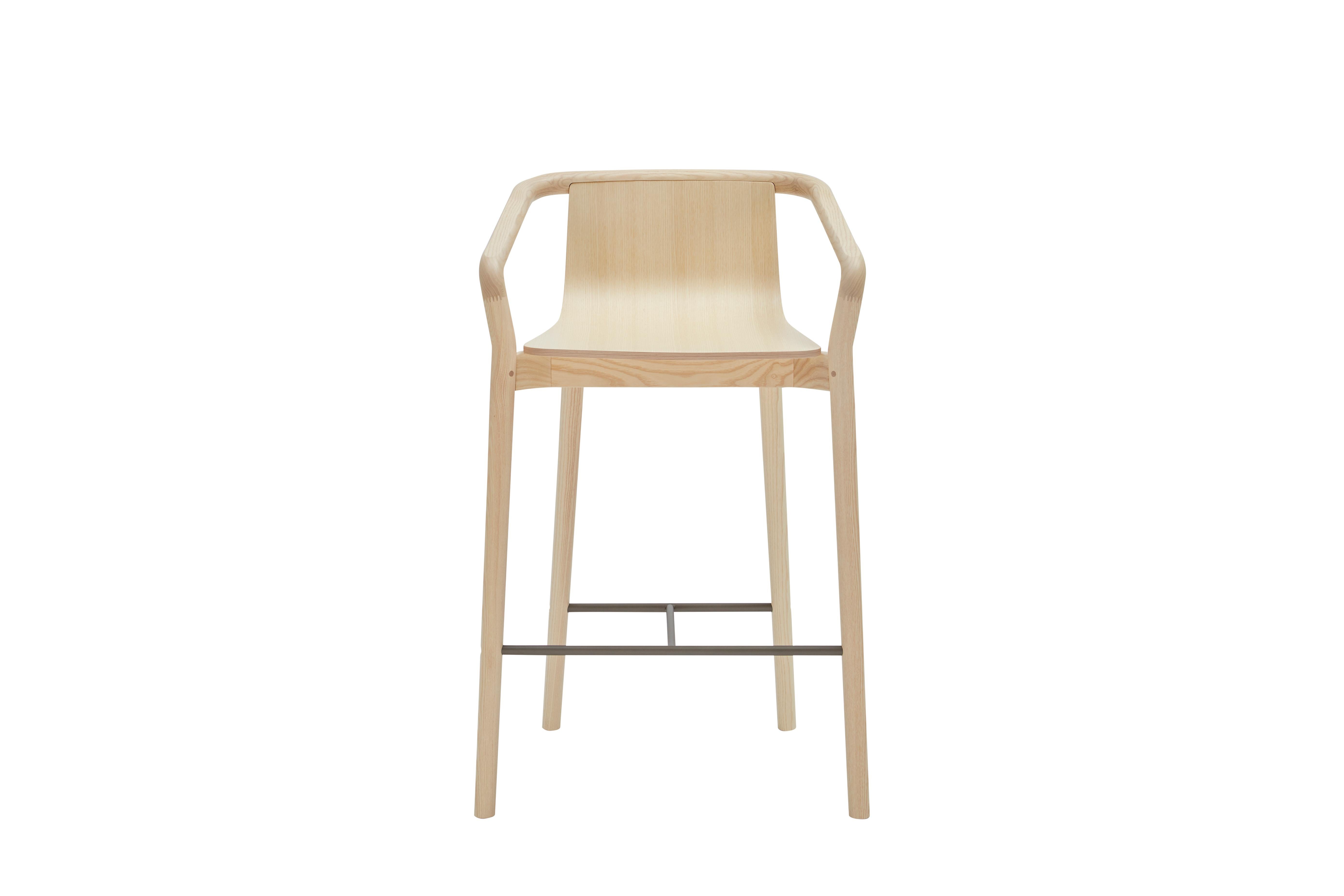 The Thomas barstool completes the Thomas Family and is derived from the same design elements that define the series. Featuring a formed plywood shell suspended in a solid ash frame with the distinctive carved armrest detail, the stool features a