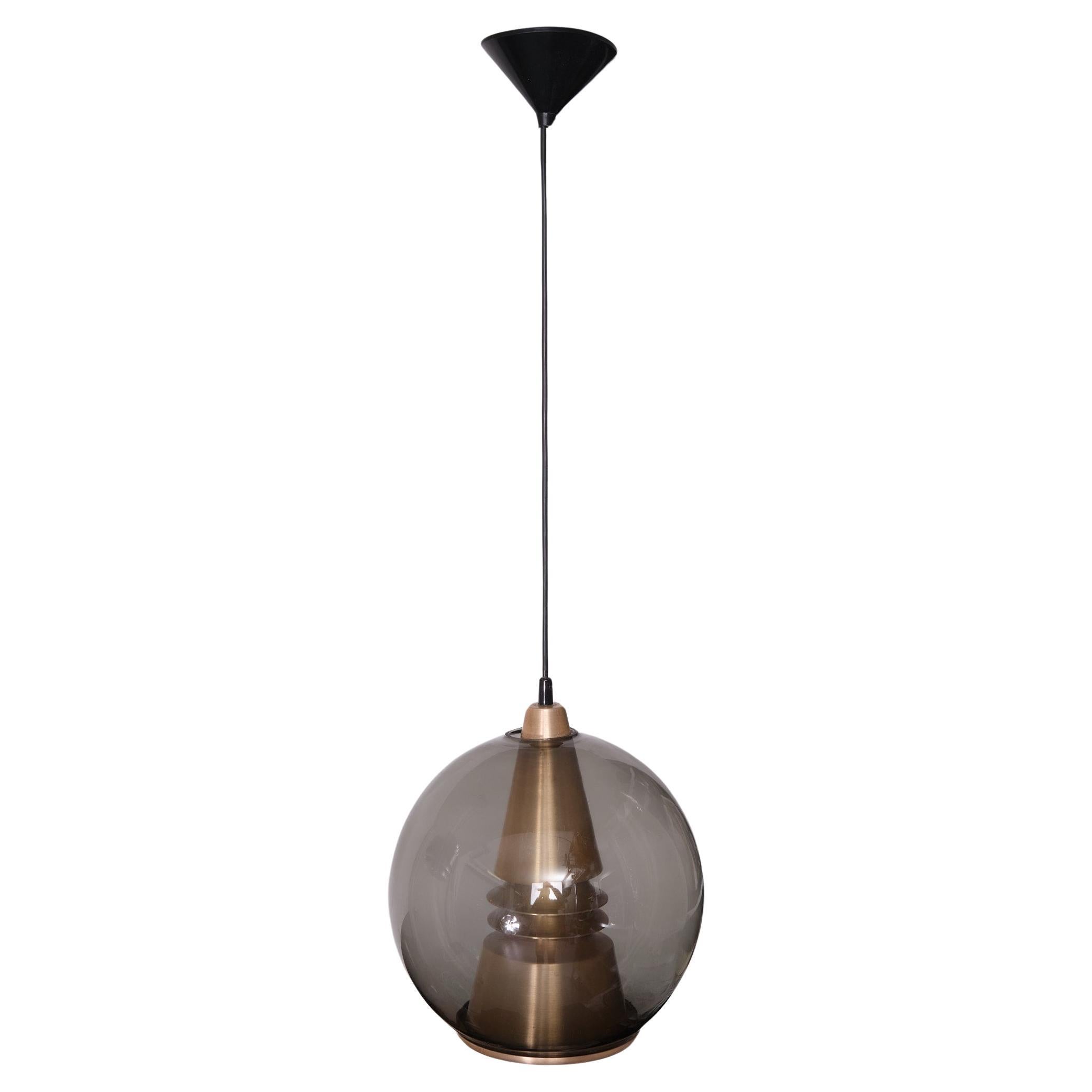 Beautiful pendant lamp. Smoked Glass dome ,comes with a Bronze 
color Aluminum shade inside .Very good quality piece . signed by
T. Røste & Co. design by  Birger Hammerstad .Norway .
very good condition .

