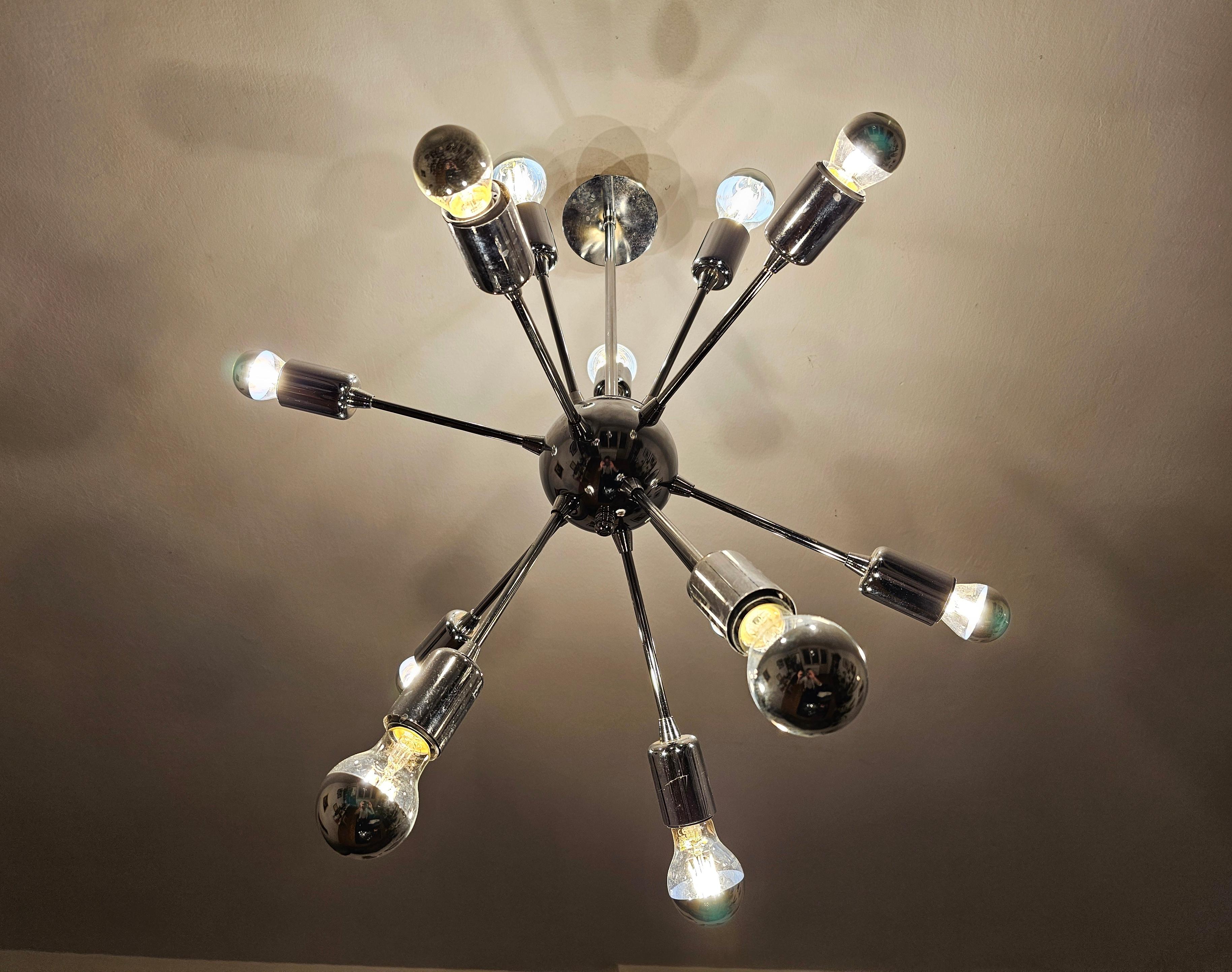 In this listing you will find a gorgeous Space Age 12-Arm Sputnik chandelier done entirely in chrome. Made in Austria in 1980s.

Very good vintage condition with small signs of time and use. Wired to be used anywhere in the world. Bulbs are not