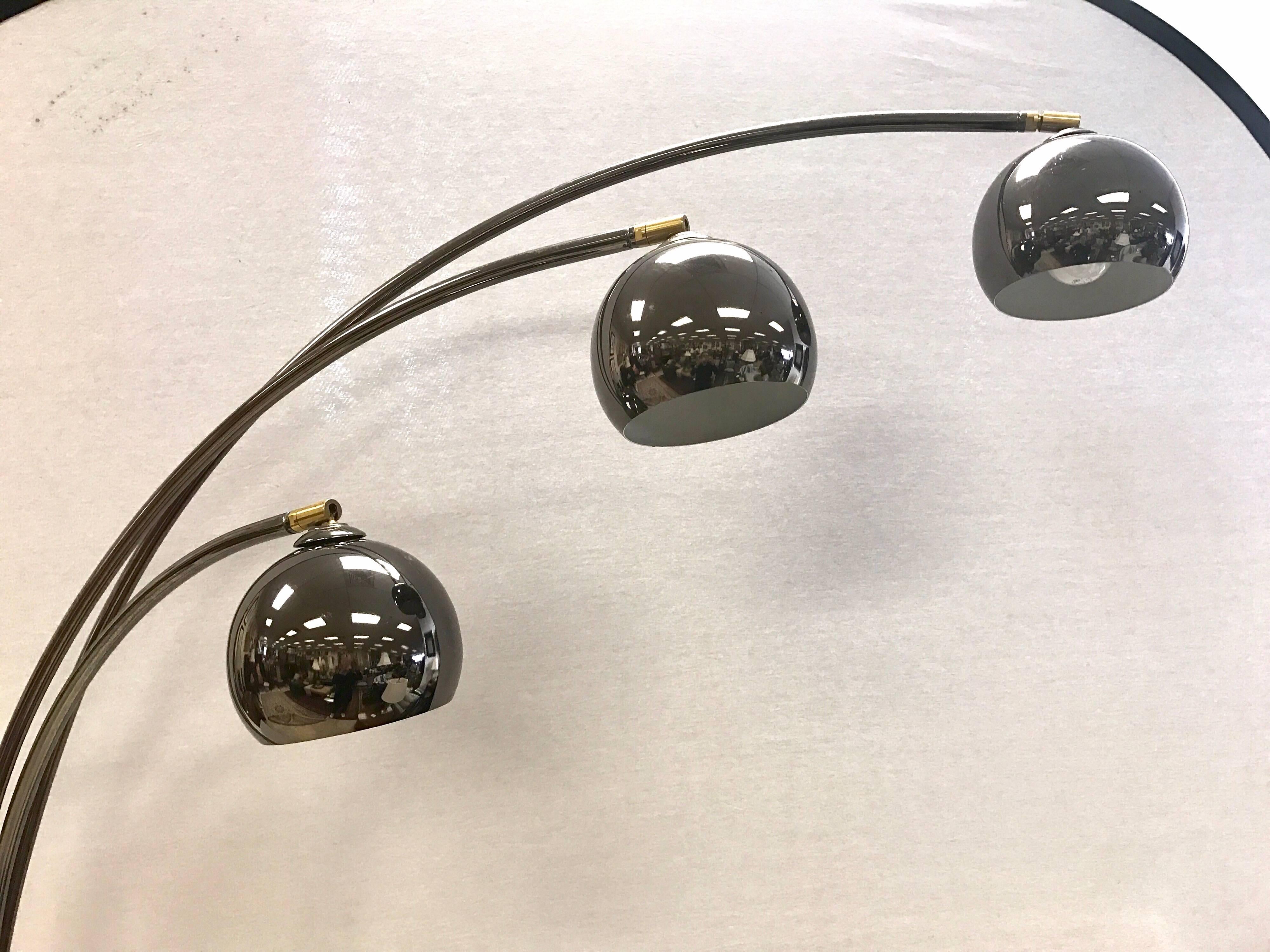 Atomic chrome atomic arc floor lamp with carrera marble base. Arms are adjustable and shades are a slightly darker shade of chrome versus the arms which really makes this floor lamp stand out from the crowd.