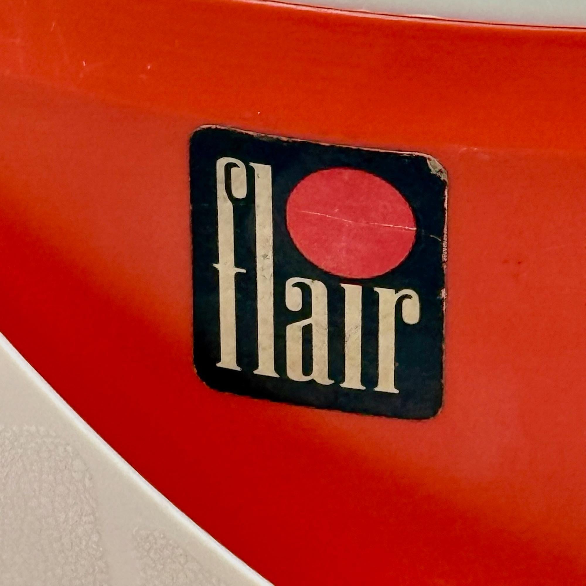 Brighten your space with this original orange 70s stool produced by Flair, designed for organizing sewing tools in style. Its playful, compact form features a practical carrying handle, a built-in yarn holder, and a spacious hidden compartment