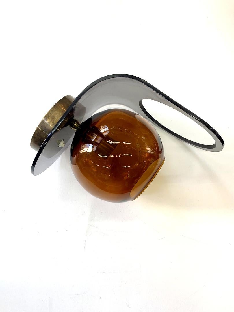 Space Age acrylic and amber glass wall light, 1960s.