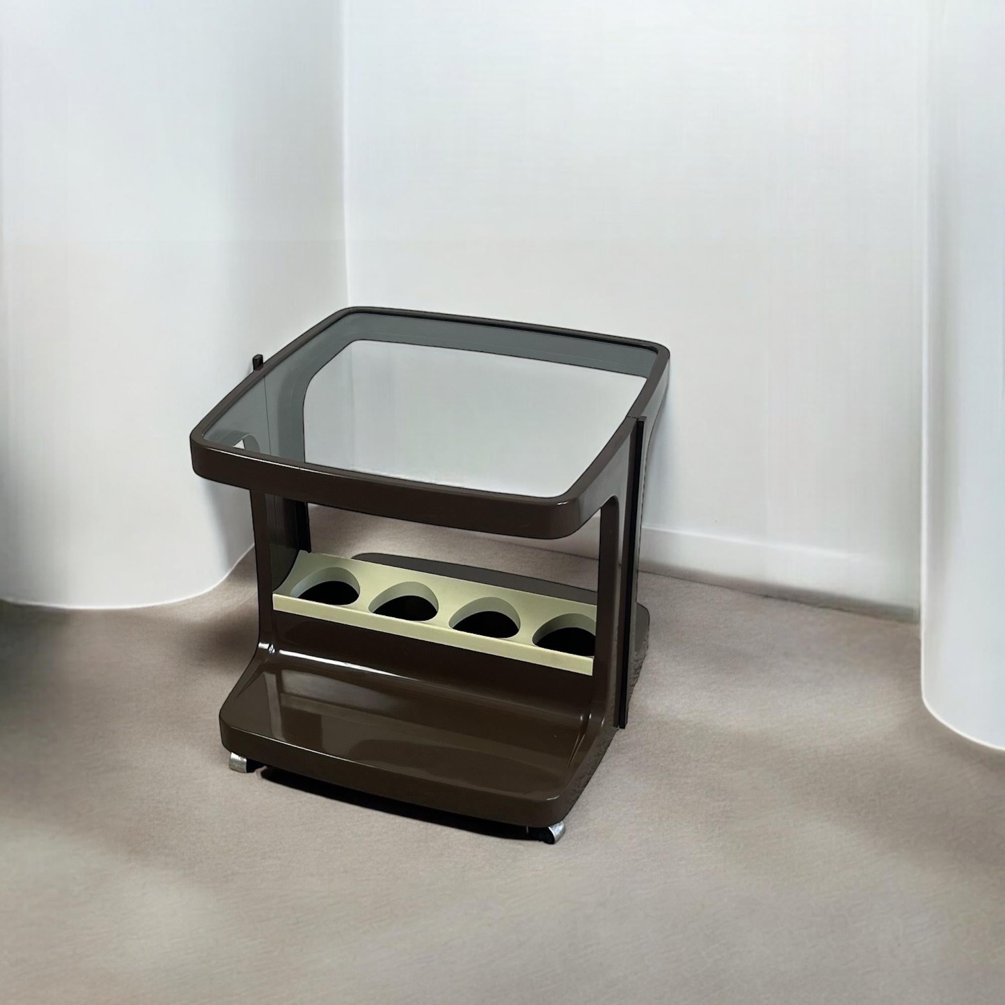 Lovely and rare space age bar cart designed by Marc Held for Prisunic and produced by Monoprix in the 70s.

This beautiful mobile bar with wheels is made of thermodrilled thick plastic with sinuous curved shapes. It is equipped with a thick